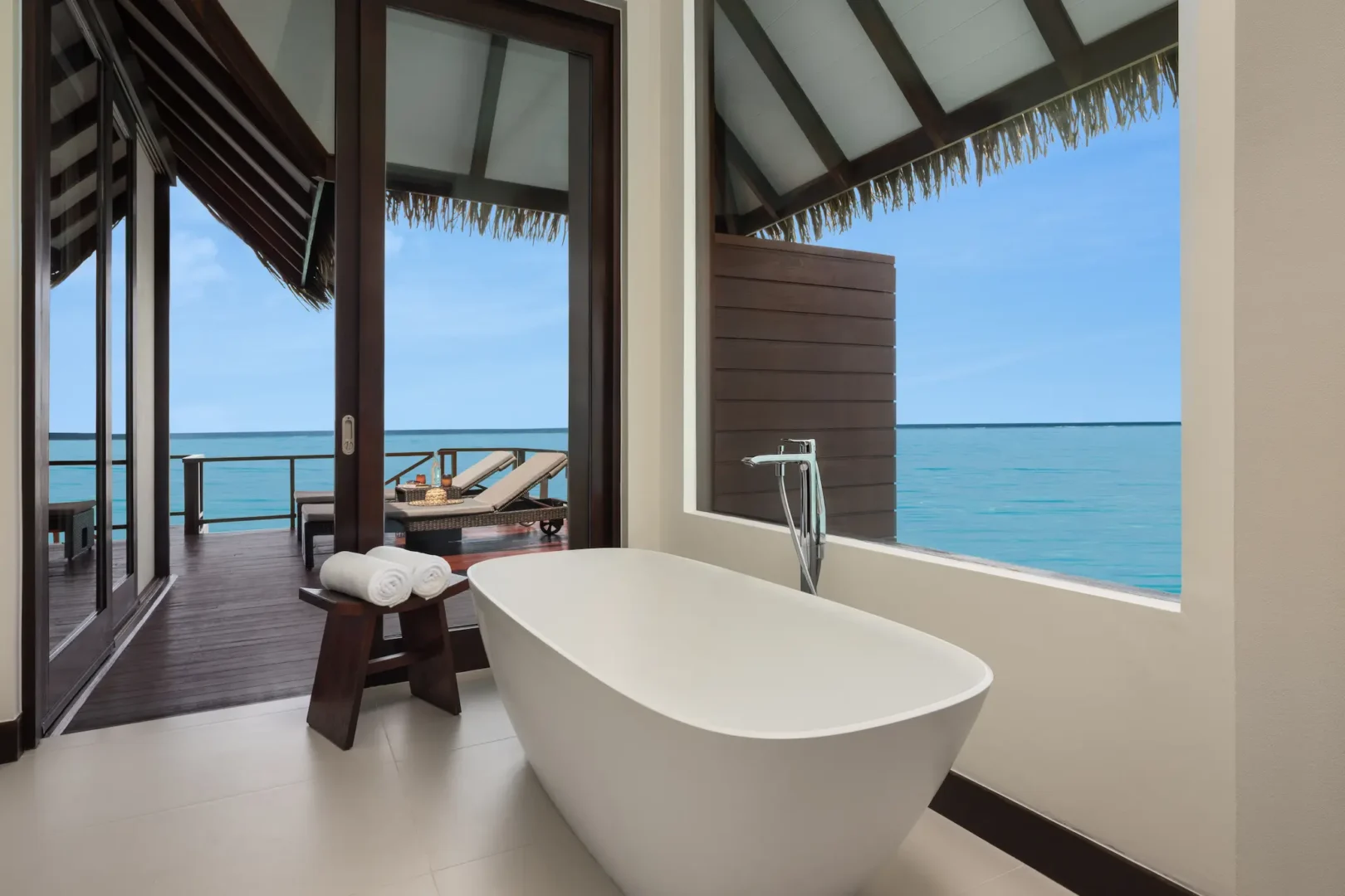 heritance aarah maldives ocean villa bathroom featuring elegant overwater design with serene natural textures and a calming spa inspired ambience