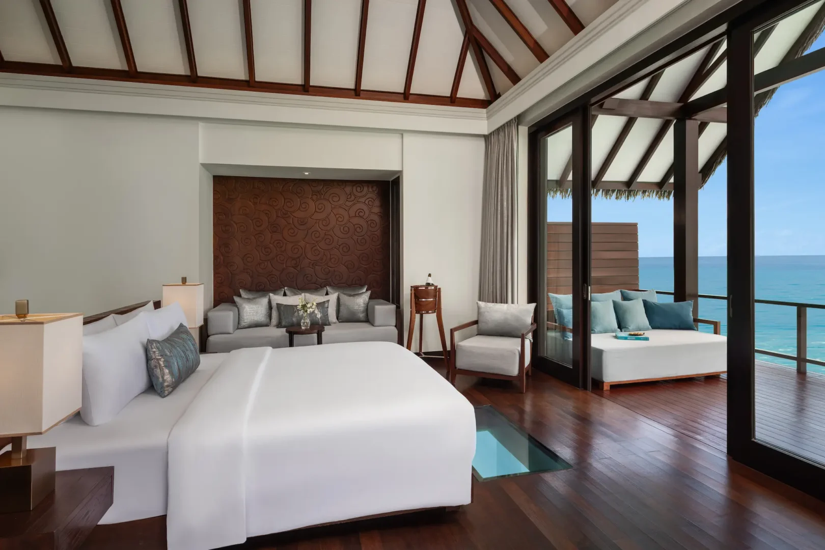 heritance aarah maldives ocean villa room featuring a refined overwater interior with elegant natural textures and serene lagoon facing ambience
