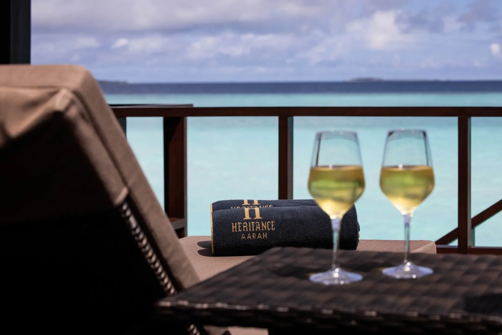 heritance aarah maldives ocean villa wine detail showcasing an elegant overwater setting with refined tropical ambience
