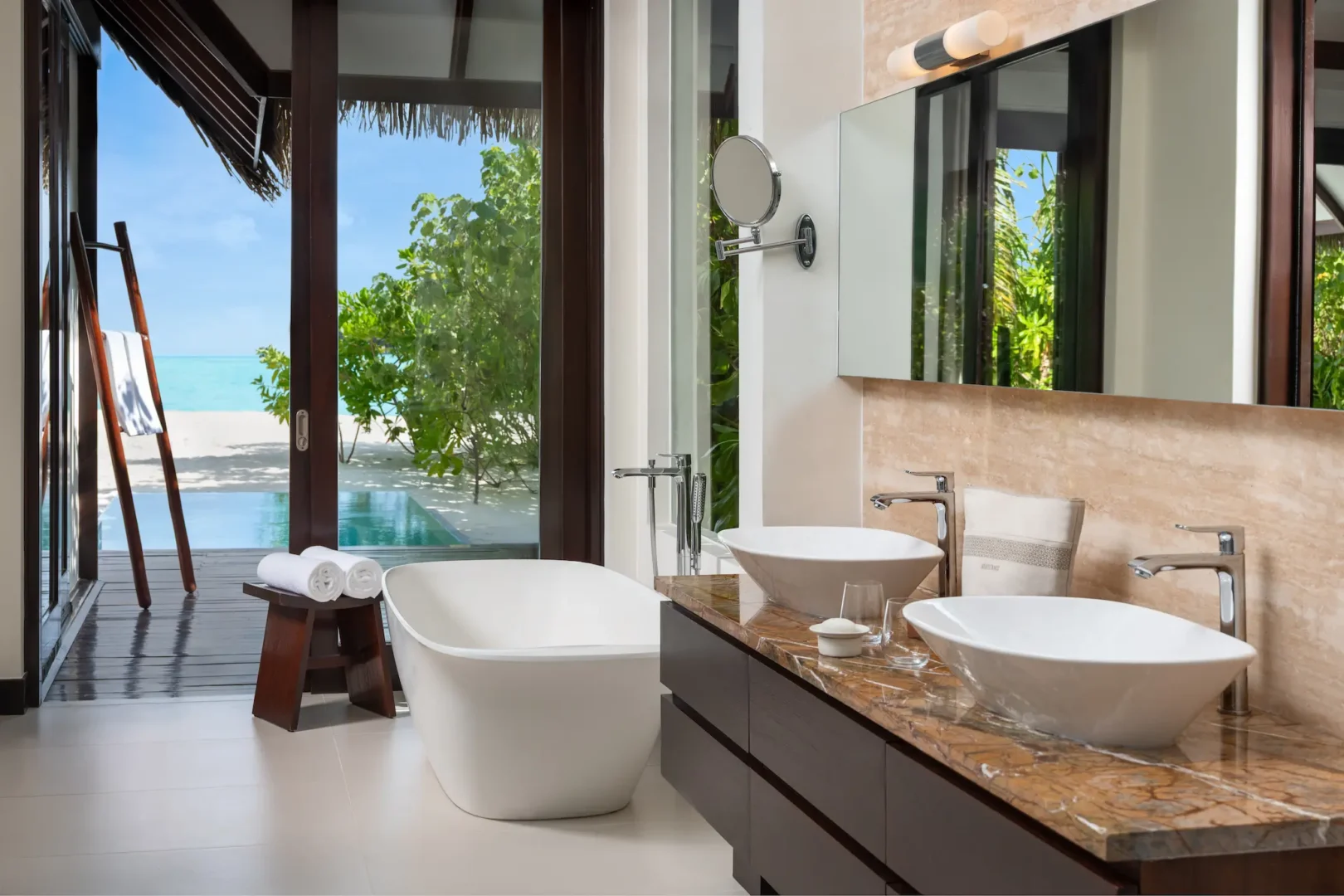 heritance aarah maldives pool beach villa bathroom featuring a refined tropical design with elegant natural textures