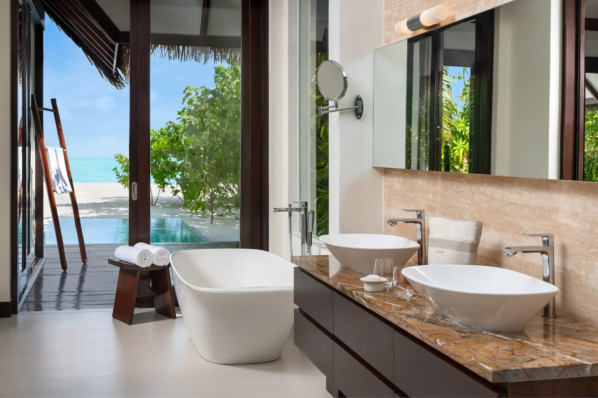 heritance aarah maldives pool beach villa bathroom featuring a refined tropical design with elegant natural textures