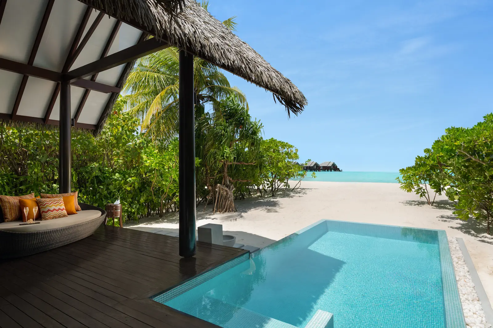 heritance aarah maldives pool beach villa deck with a tranquil oceanfront setting and elegant outdoor lounging space