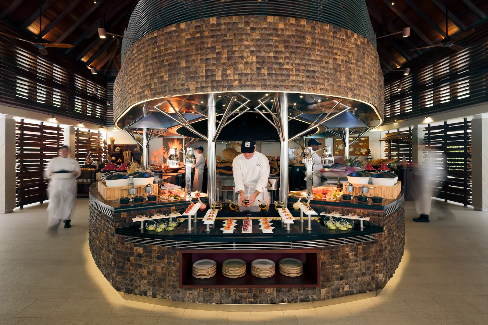 heritance aarah maldives ranba buffet restaurant models enjoying a vibrant dining setting with elegant tropical ambience