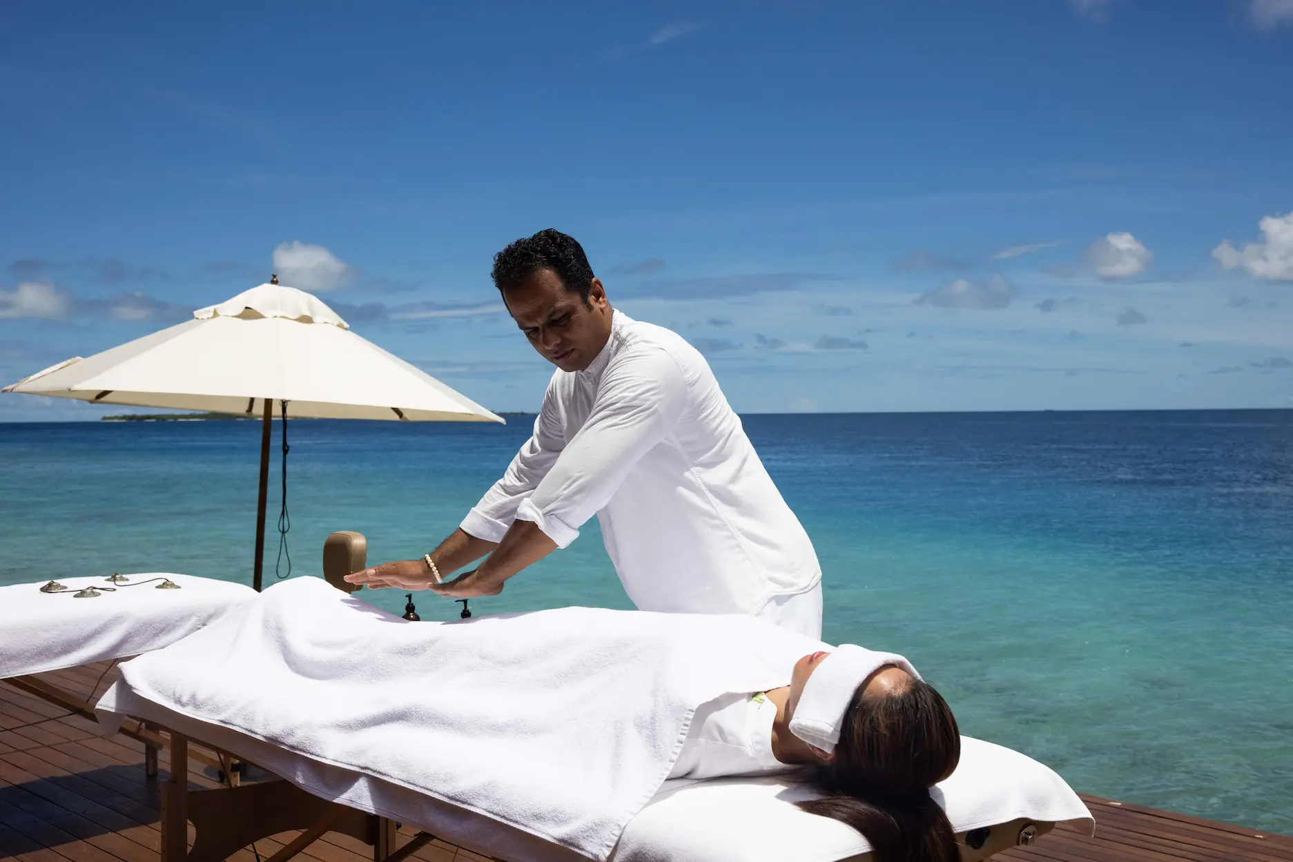 heritance aarah maldives spa reiki treatment offering a calming holistic healing experience in a serene oceanfront setting