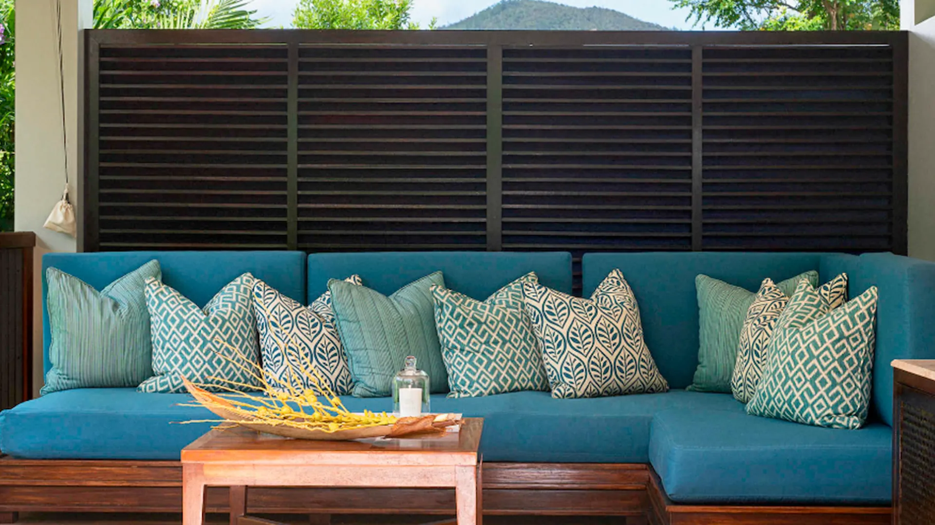 hill side pool villa in seychelles with sofa seating