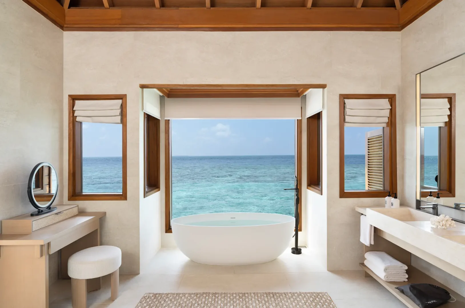 huvafen fushi maldives ocean bungalow with pool bathroom featuring an elegant overwater ensuite with refined finishes and calming lagoon views