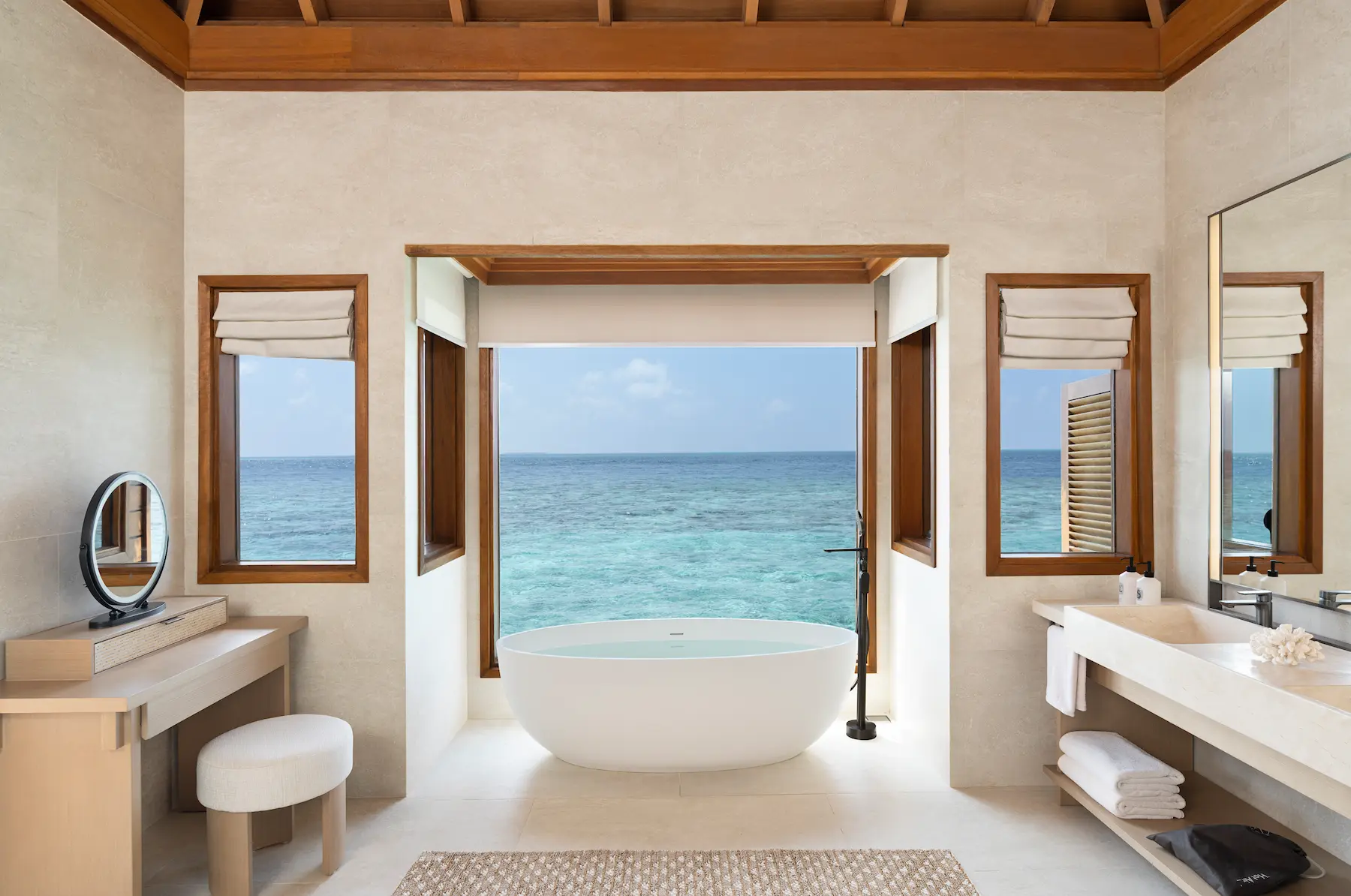 huvafen fushi maldives ocean bungalow with pool bathroom featuring an elegant overwater ensuite with refined finishes and calming lagoon views