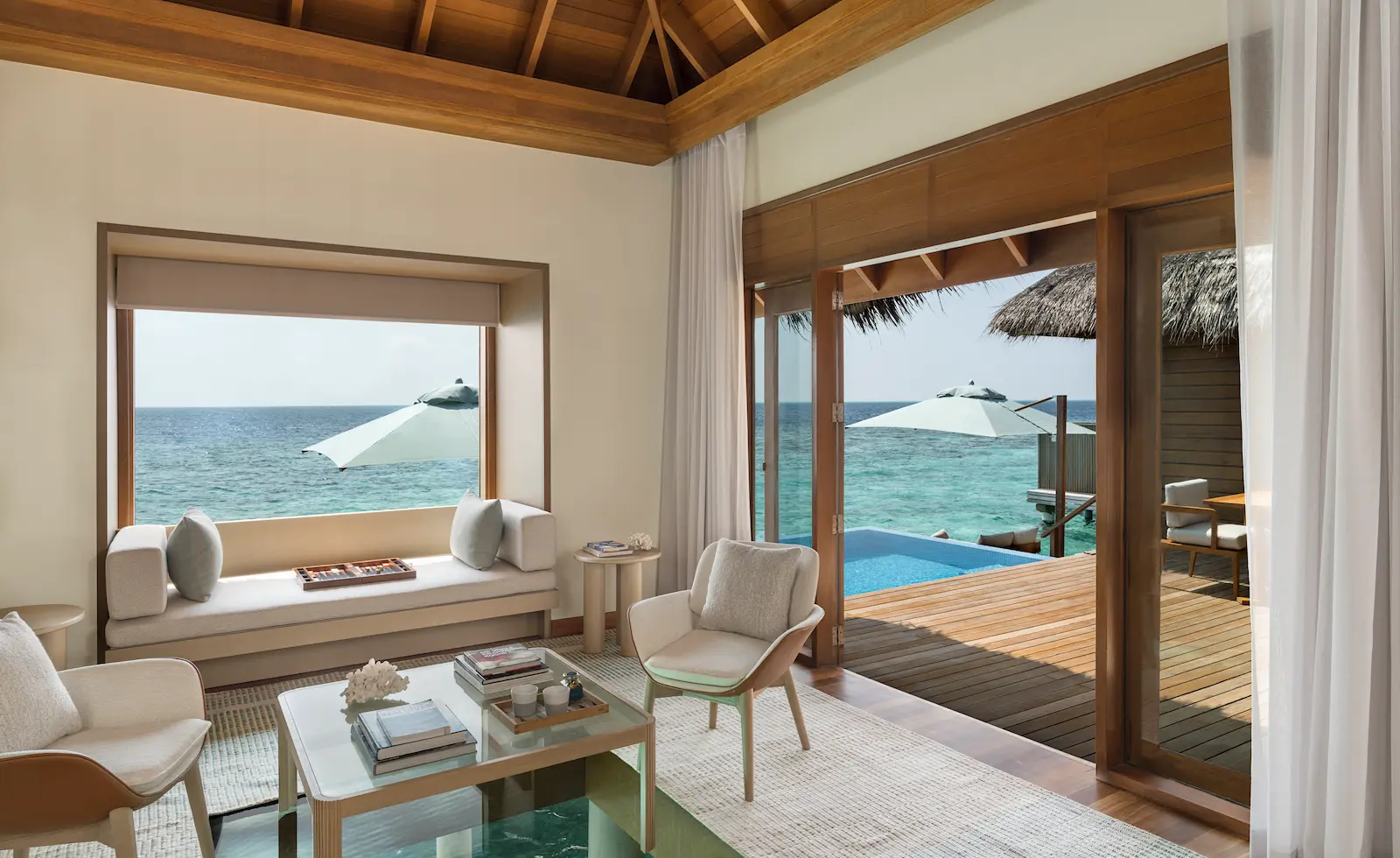 huvafen fushi maldives ocean bungalow with pool living area offering an elegant overwater lounge space with refined textures and tranquil lagoon views