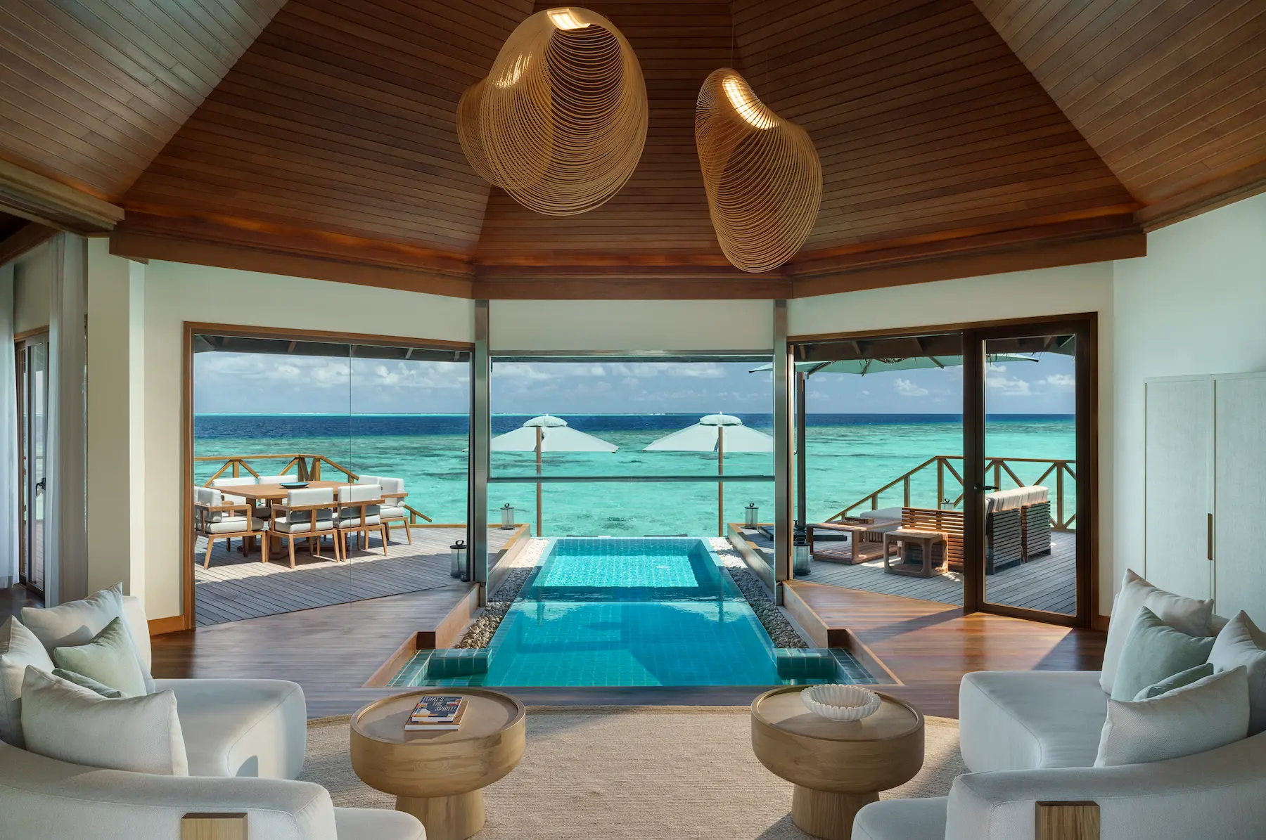 huvafen fushi maldives ocean pavilion with indoor outdoor pool showcasing a luxurious seamless living space with serene lagoon views and refined island ambience