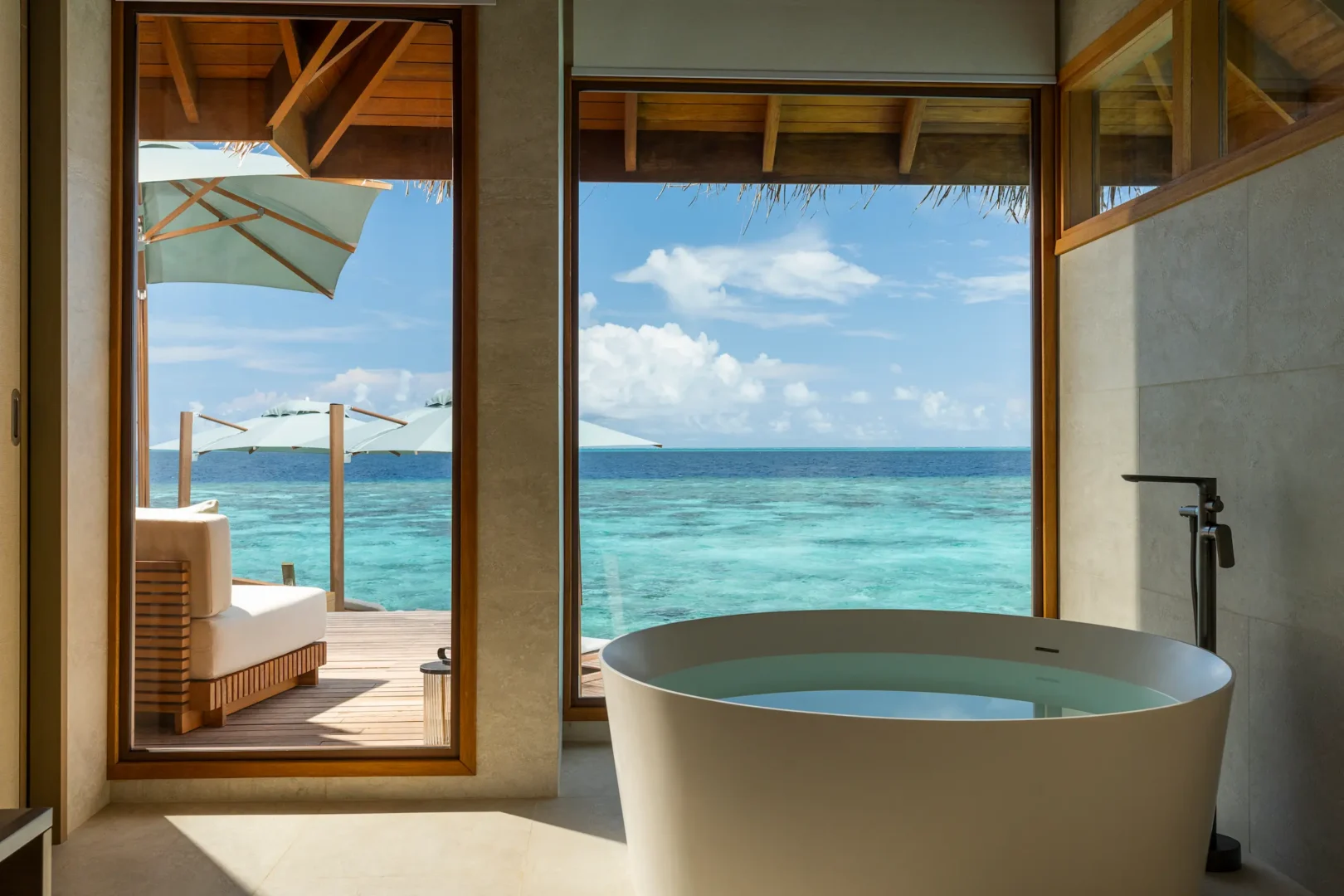 huvafen fushi maldives ocean pavilion with pool bath featuring an elegant overwater ensuite with refined finishes and serene lagoon views