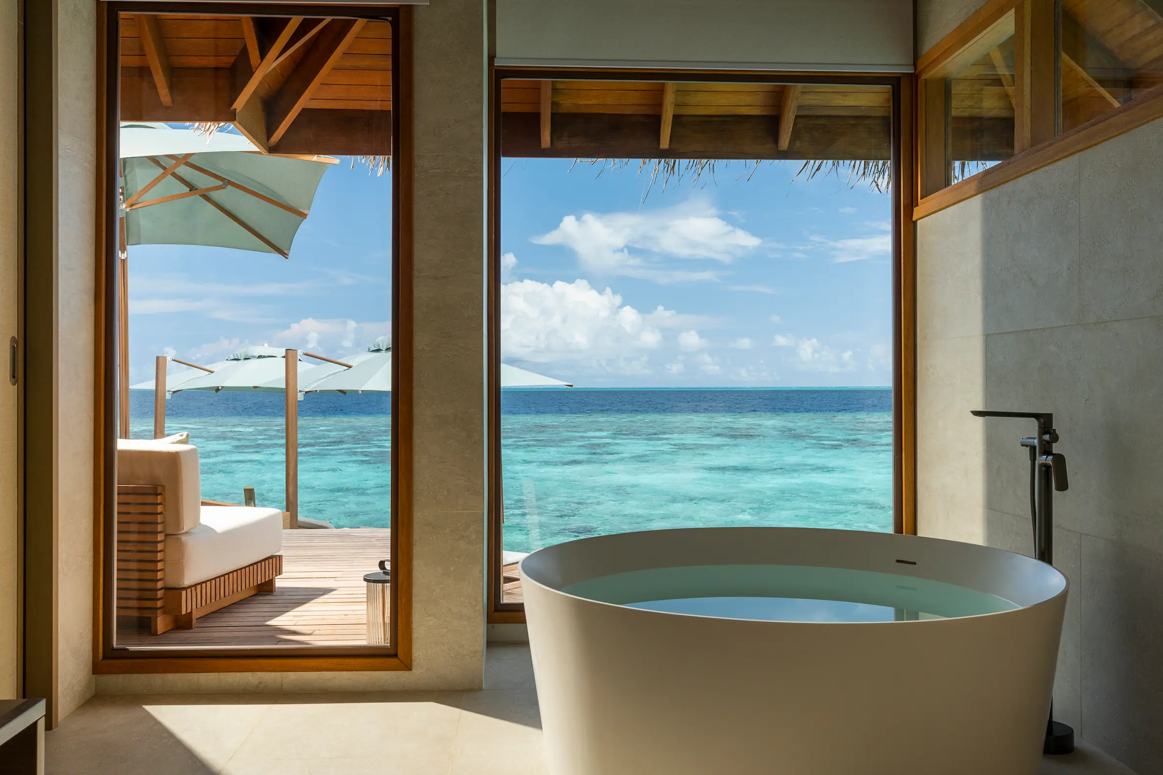 huvafen fushi maldives ocean pavilion with pool bath featuring an elegant overwater ensuite with refined finishes and serene lagoon views