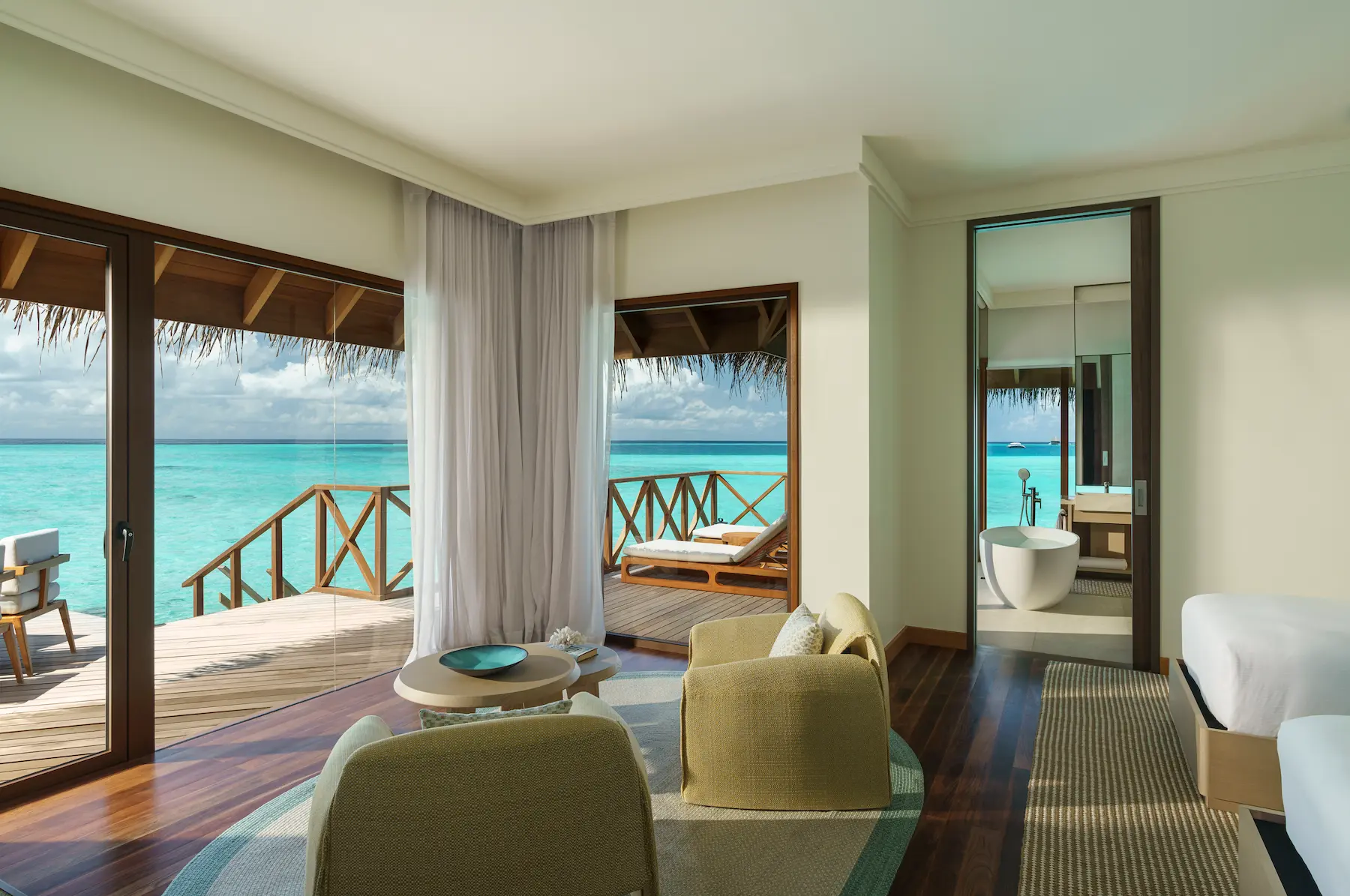 huvafen fushi maldives ocean pavilion with pool living area offering an elegant overwater lounge space with refined textures and calming lagoon views