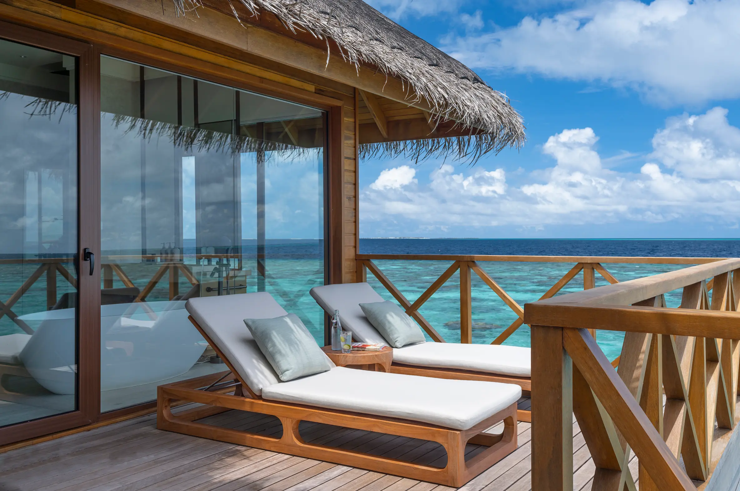 huvafen fushi maldives ocean pavilion with pool second bath deck offering an elegant overwater bathing and outdoor lounging