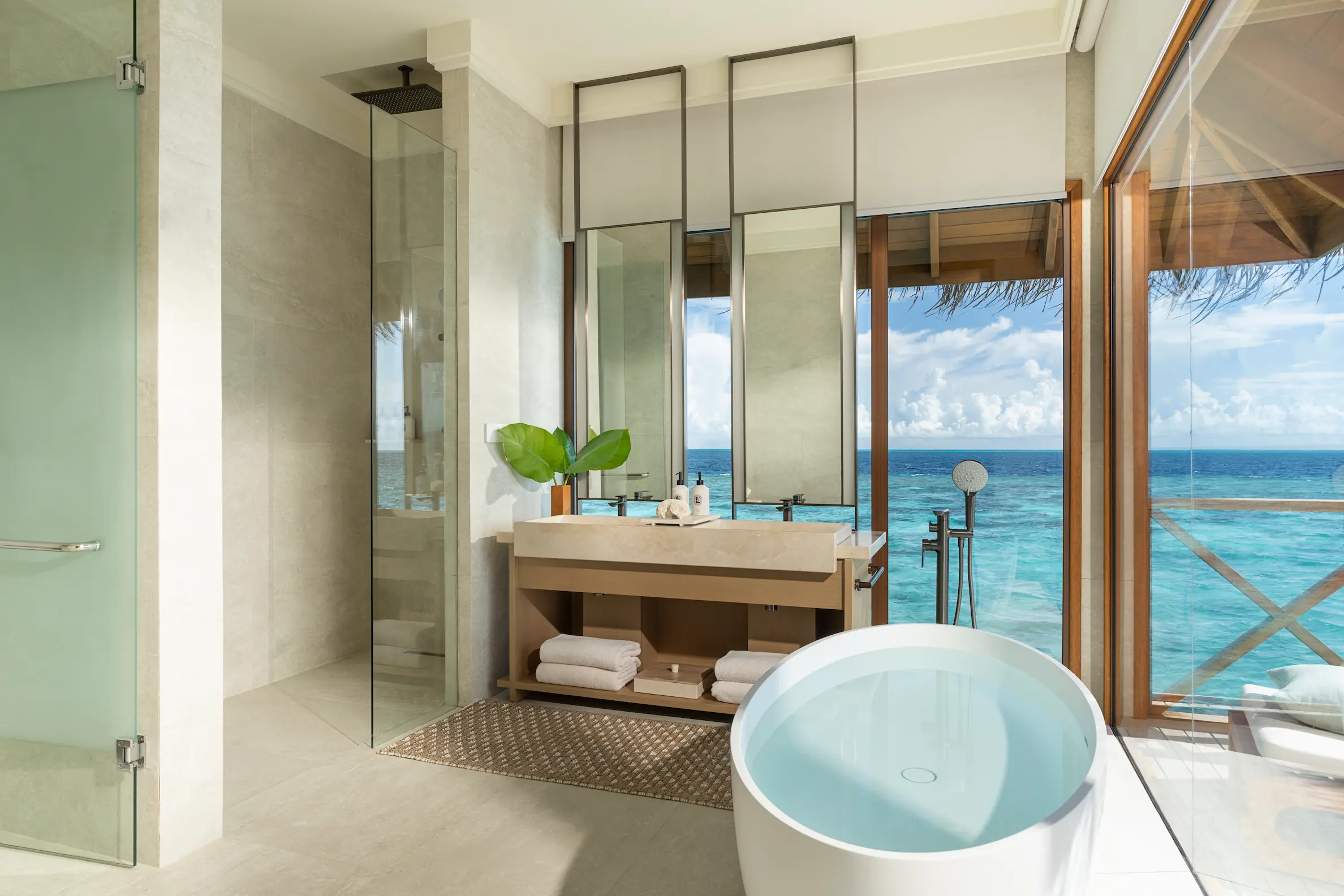 huvafen fushi maldives ocean pavilion with pool second bath featuring an elegant overwater ensuite with refined finishes and calming lagoon ambience