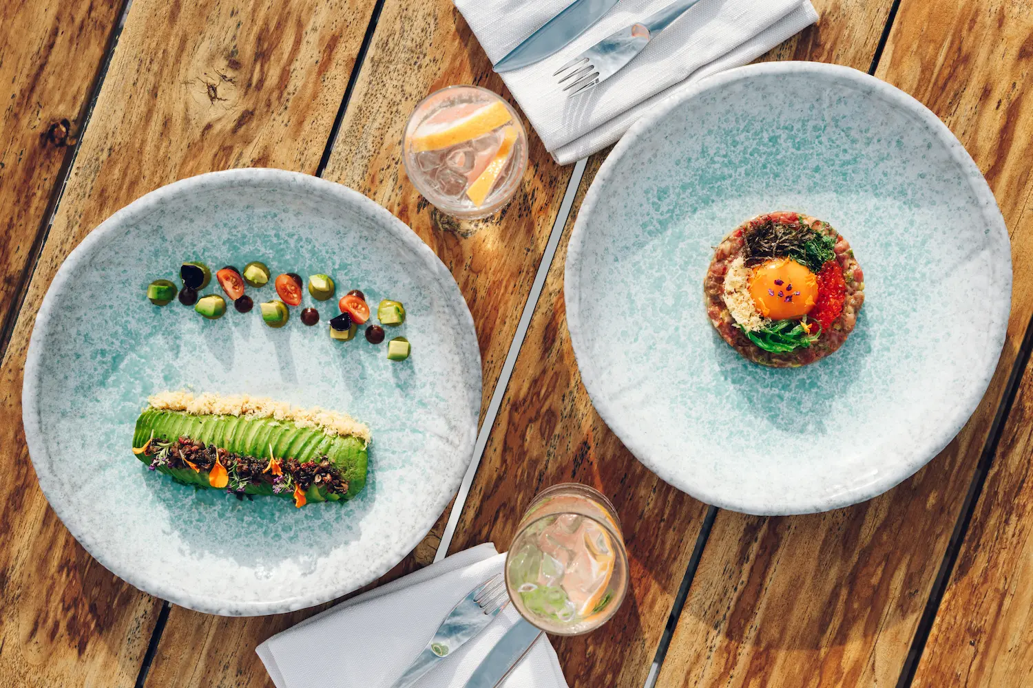 huvafen fushi maldives raw showcasing an elegant overwater dining space with refined island ambience and serene lagoon views