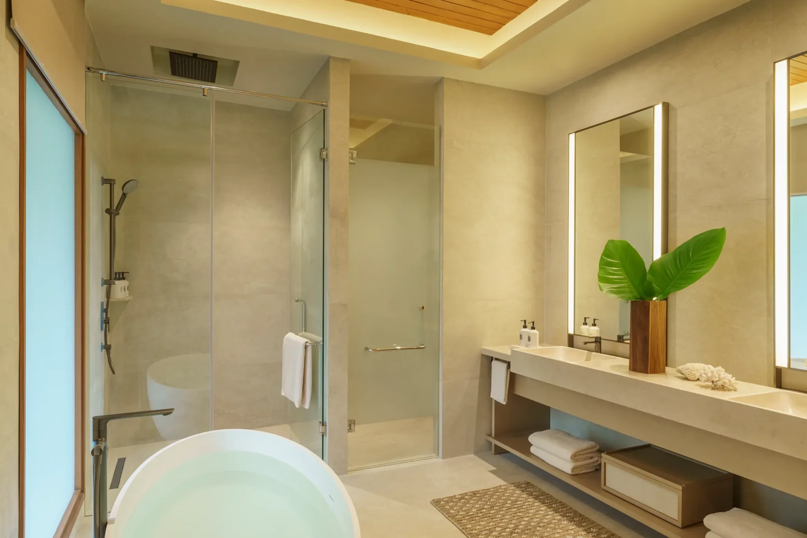 huvafen fushi maldives two bedroom beach house with pool bathroom featuring an elegant beachfront ensuite with refined finishes and serene tropical ambience