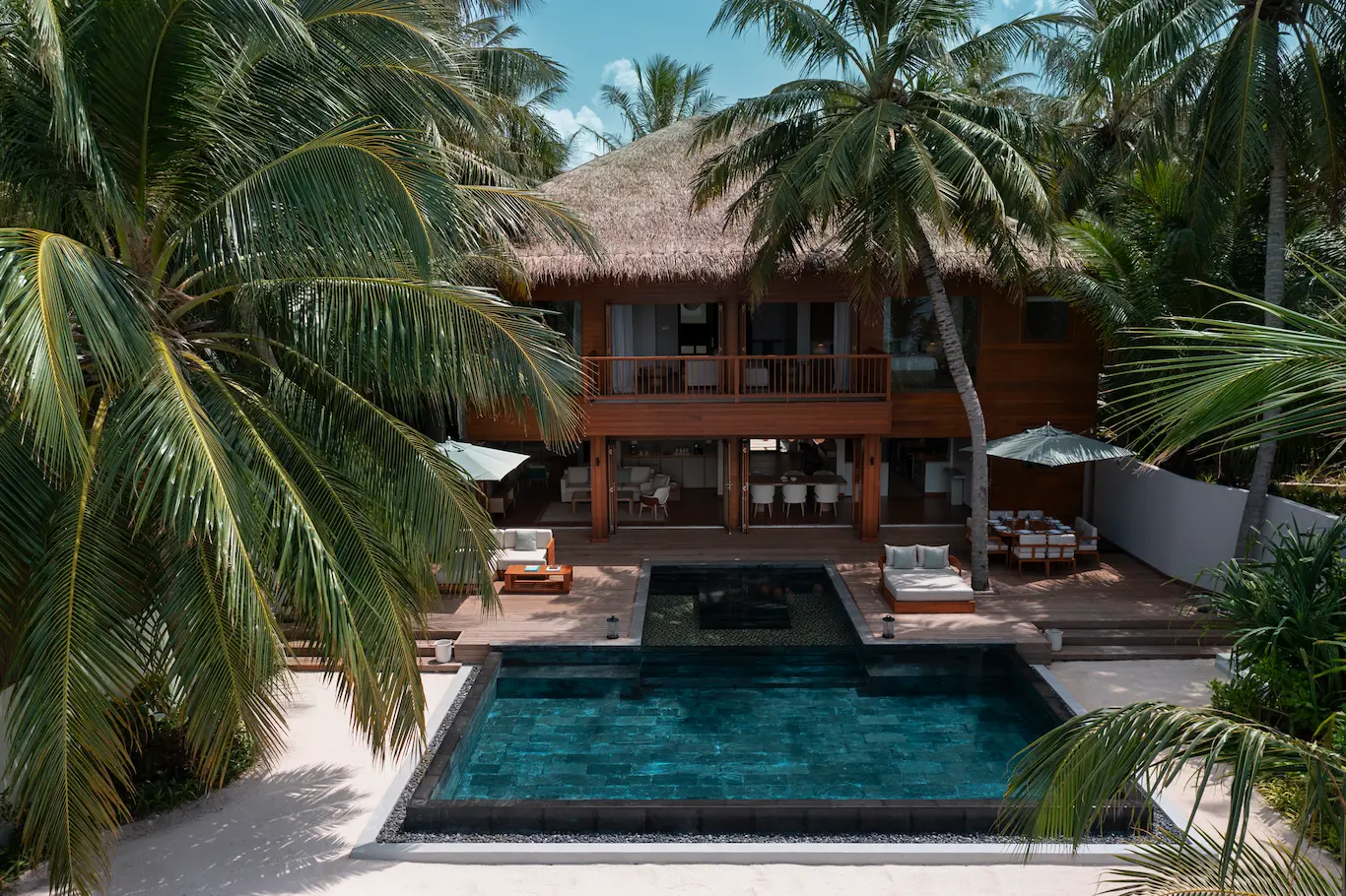 huvafen fushi maldives two bedroom beach house with pool exterior showcasing a spacious beachfront residence with refined island architecture and serene tropical surroundings