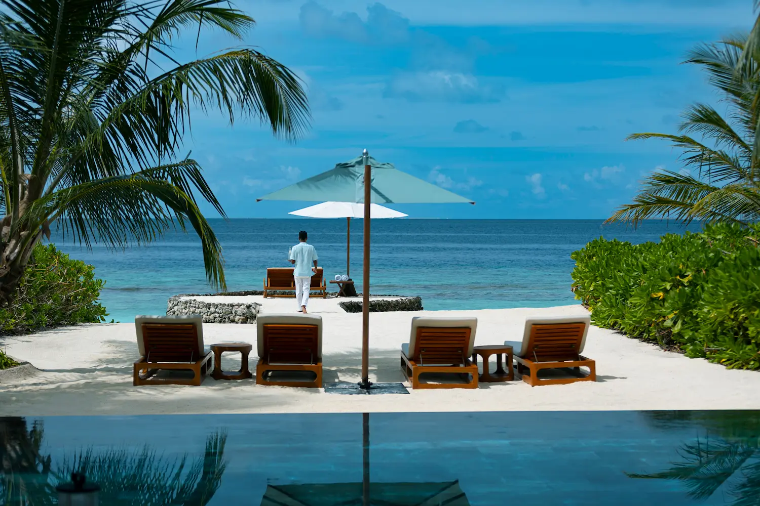 huvafen fushi maldives two bedroom beach house with pool view offering a spacious beachfront residence with tranquil ocean scenery and refined island ambience
