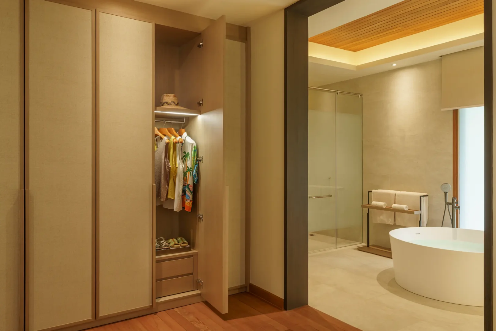 huvafen fushi maldives two bedroom beach house with pool wardrobe featuring a refined walk in storage space with elegant finishes