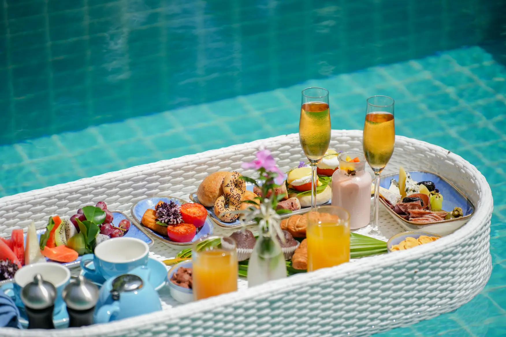 ifuru island maldives f and b floating breakfast presented in a serene luxury pool setting with elegant contemporary island style