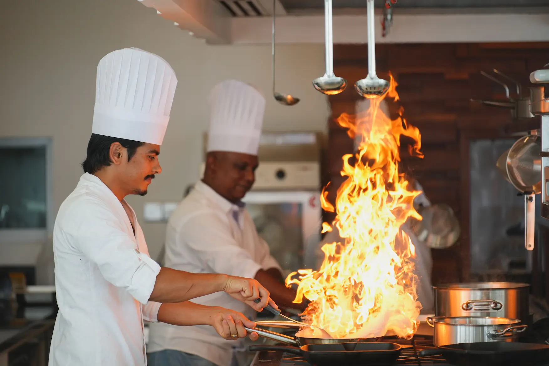 ifuru island maldives f and b lifestyle chefs preparing dishes in a refined contemporary island setting with serene luxury ambience