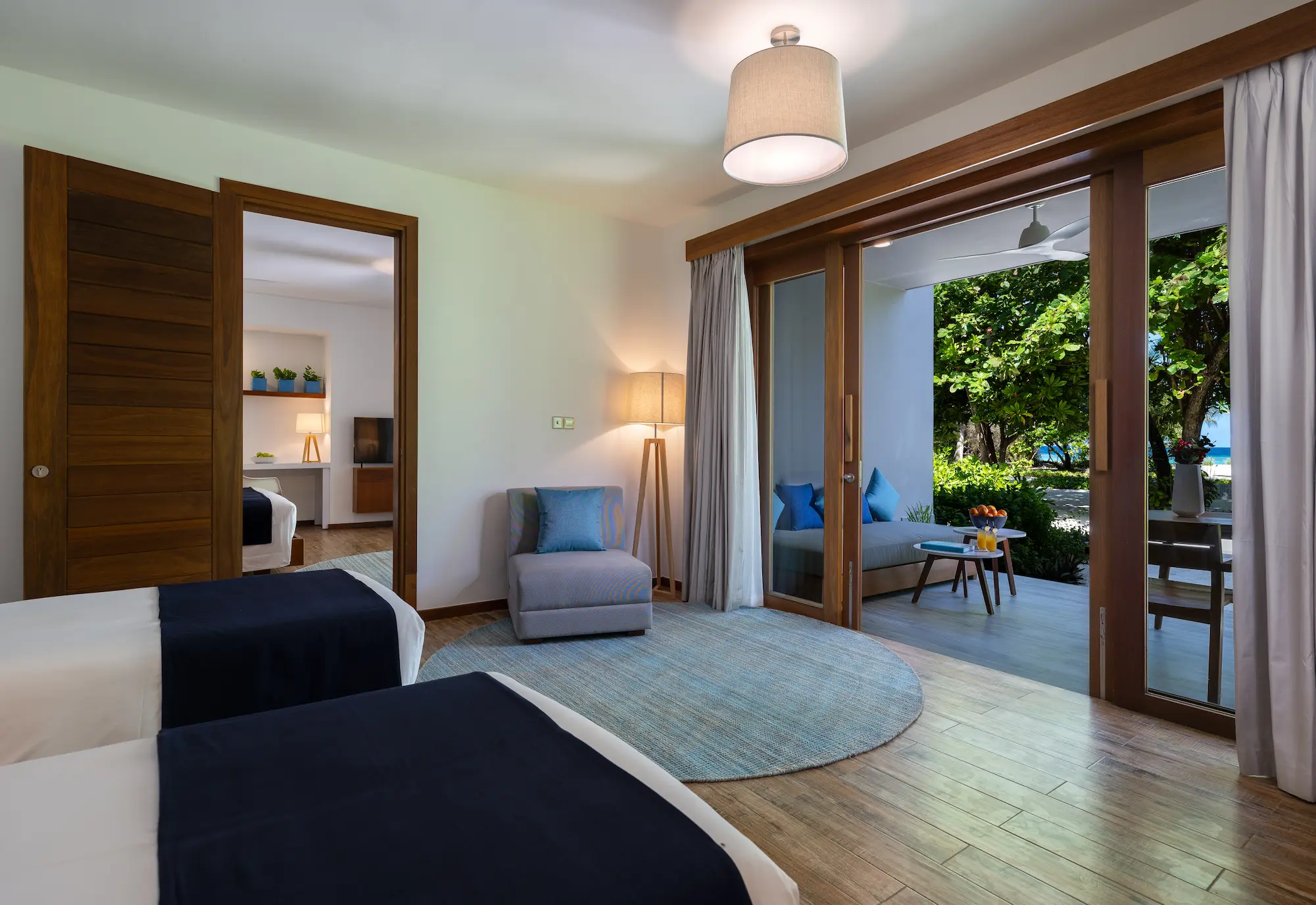 ifuru island maldives sunset beach suite connecting room with elegant contemporary design and serene luxury family friendly ambience