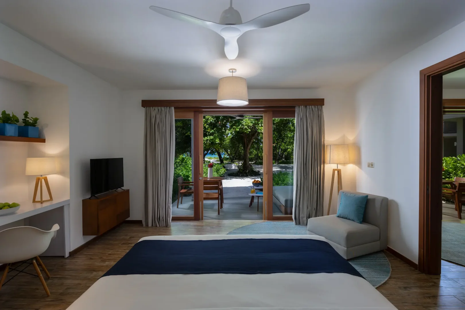ifuru island maldives sunset beach suite interior with refined contemporary design and serene luxury island ambience
