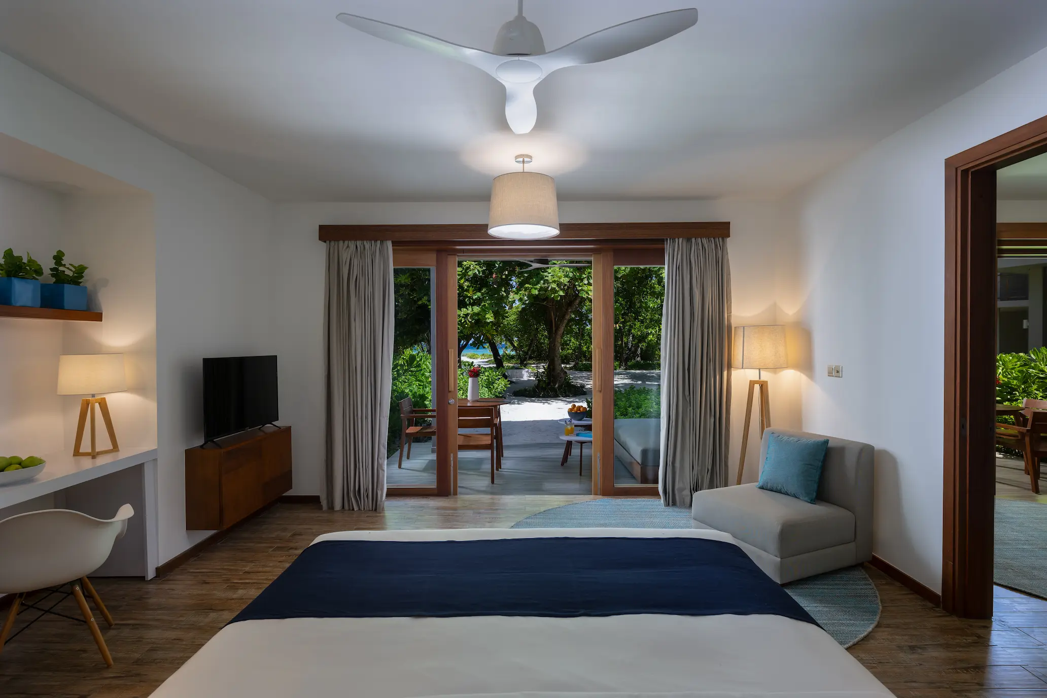 ifuru island maldives sunset beach suite interior with refined contemporary design and serene luxury island ambience