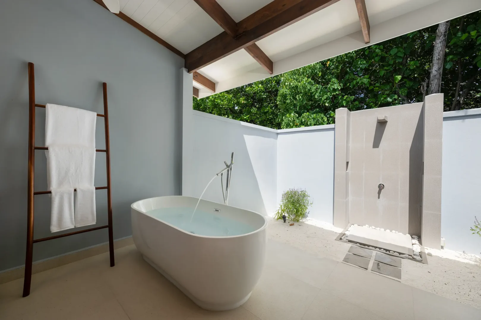 ifuru island maldives sunset beach villa bathroom with elegant contemporary finishes and serene luxury island ambience