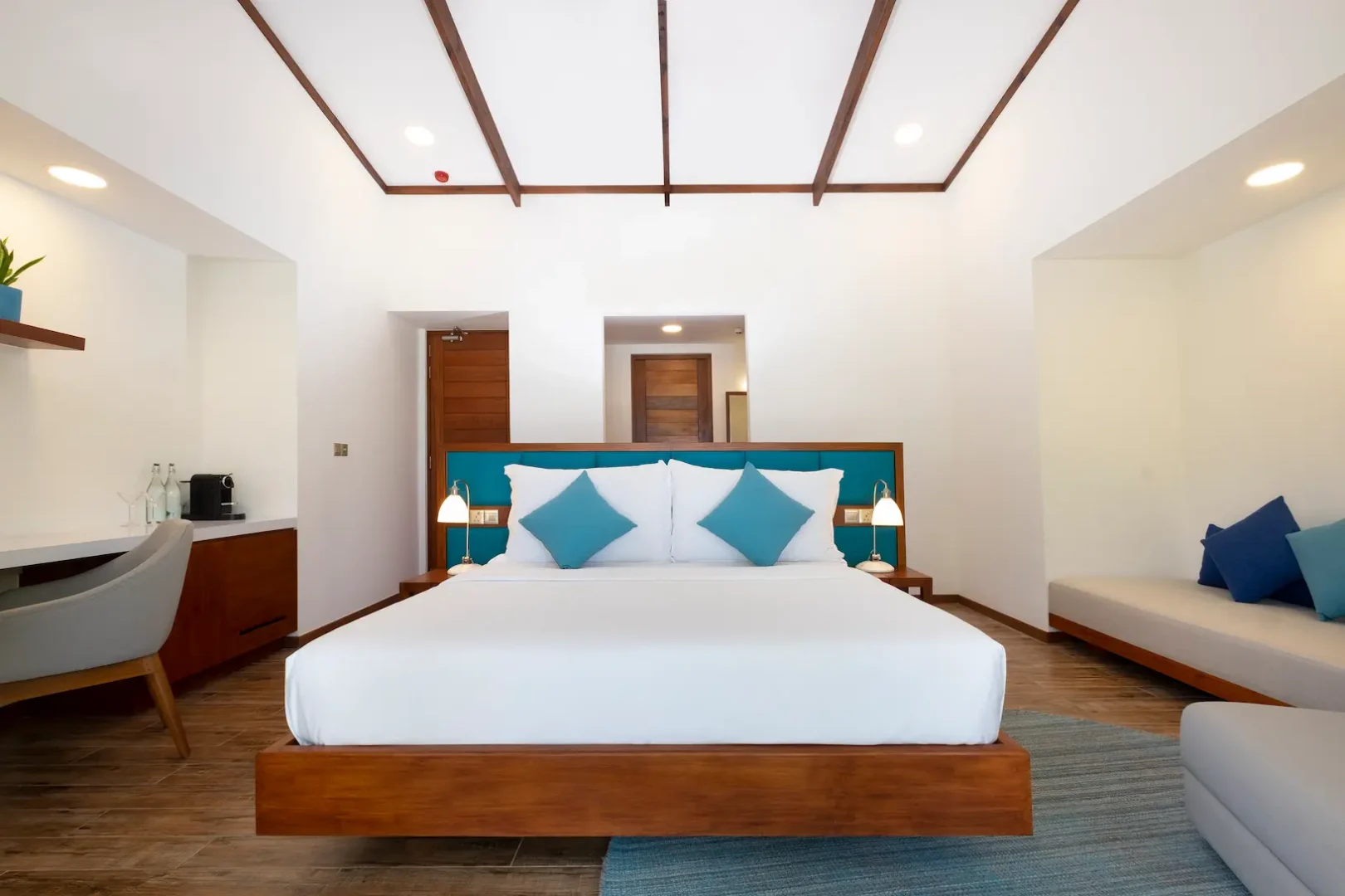 ifuru island maldives sunset beach villa bedroom with serene island luxury and refined contemporary interior design