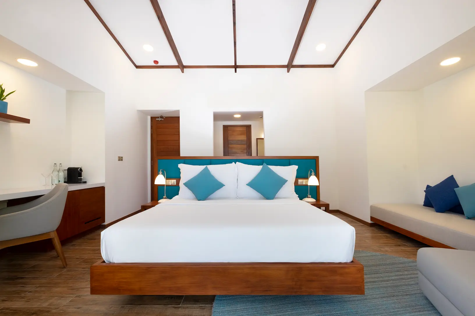 ifuru island maldives sunset beach villa bedroom with serene island luxury and refined contemporary interior design