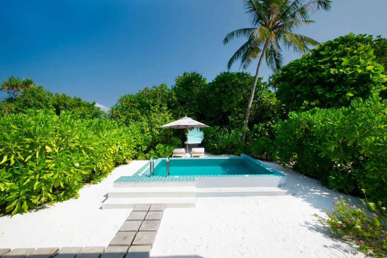 ifuru island maldives sunset beach villa with pool outdoor area featuring elegant contemporary design and serene luxury island ambience
