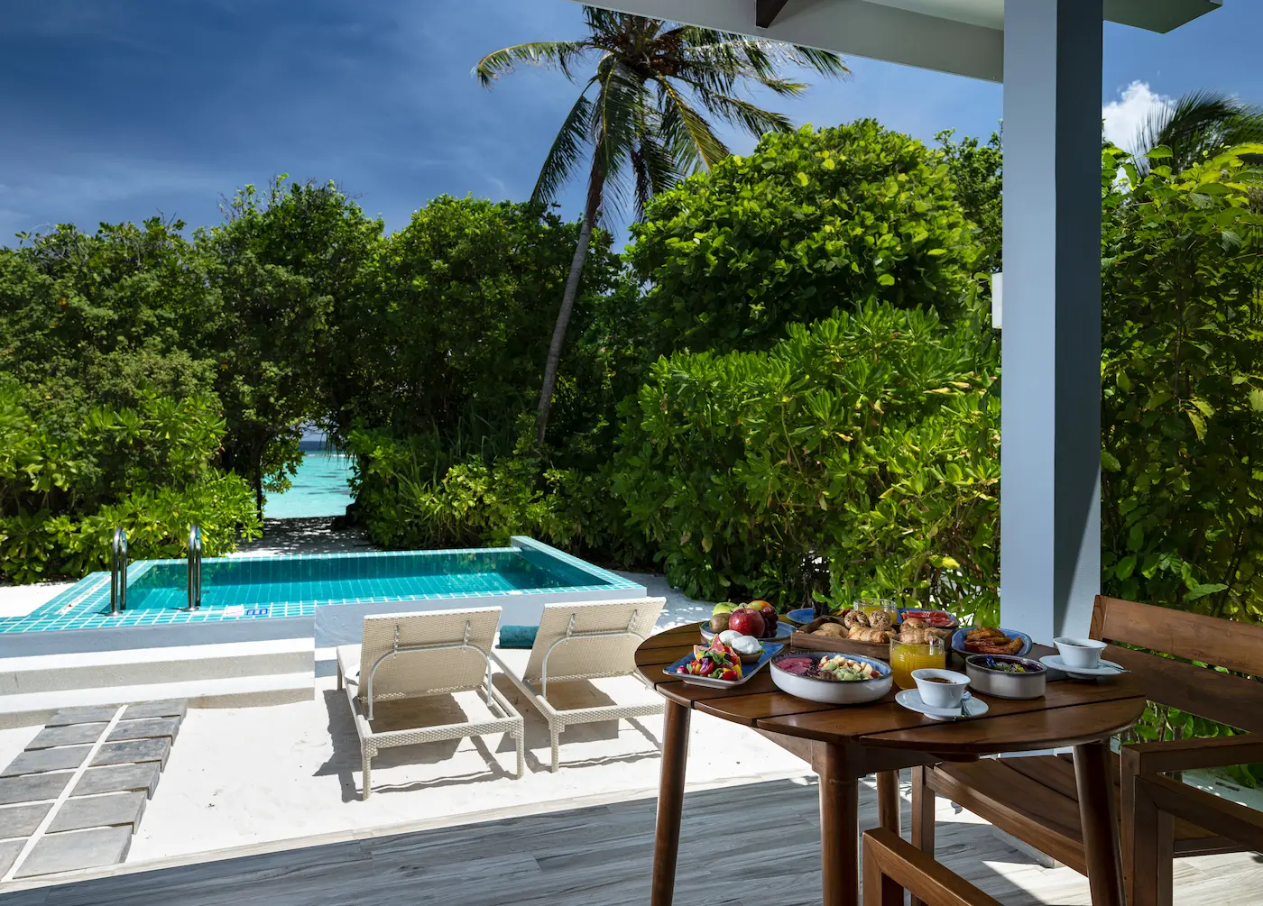 ifuru island maldives sunset beach villa with pool outdoor deck featuring serene island luxury and elegant contemporary beachfront design