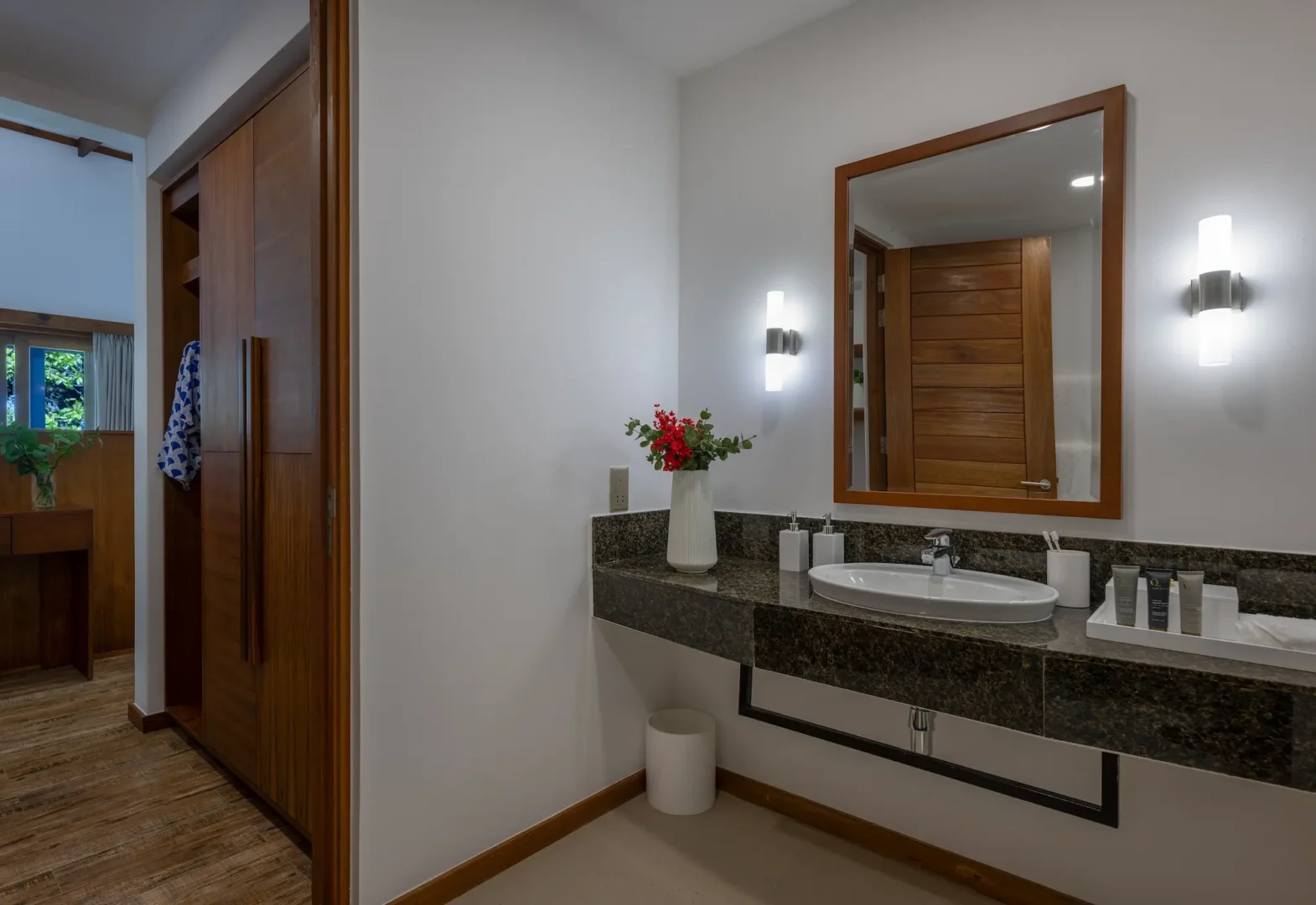ifuru island maldives sunset sky suite bathroom and changing area with elegant contemporary design and serene luxury ambience