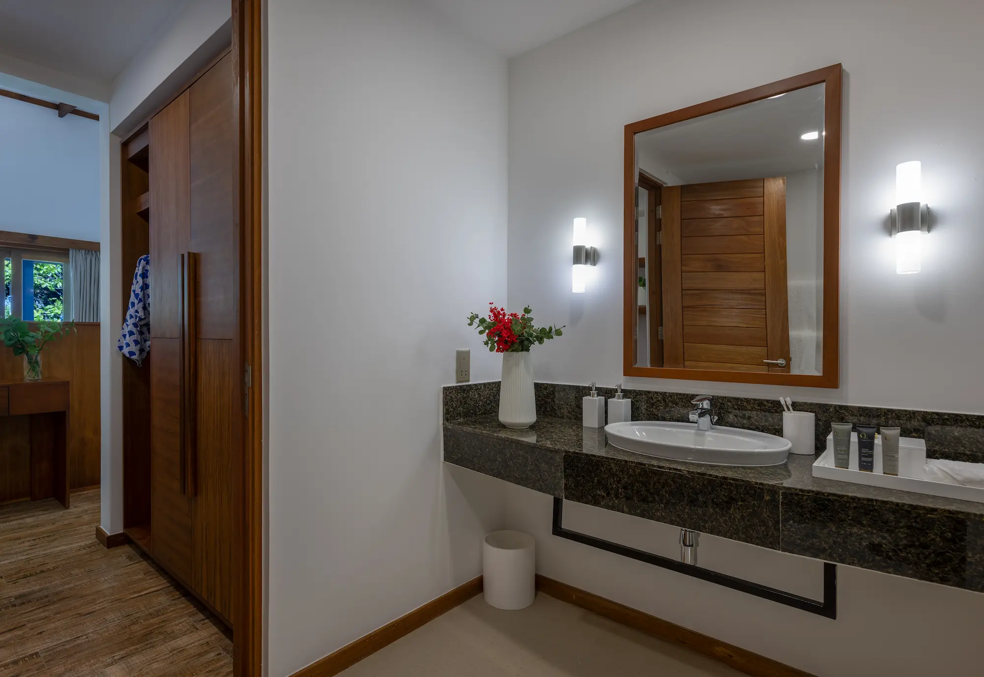 ifuru island maldives sunset sky suite bathroom and changing area with elegant contemporary design and serene luxury ambience