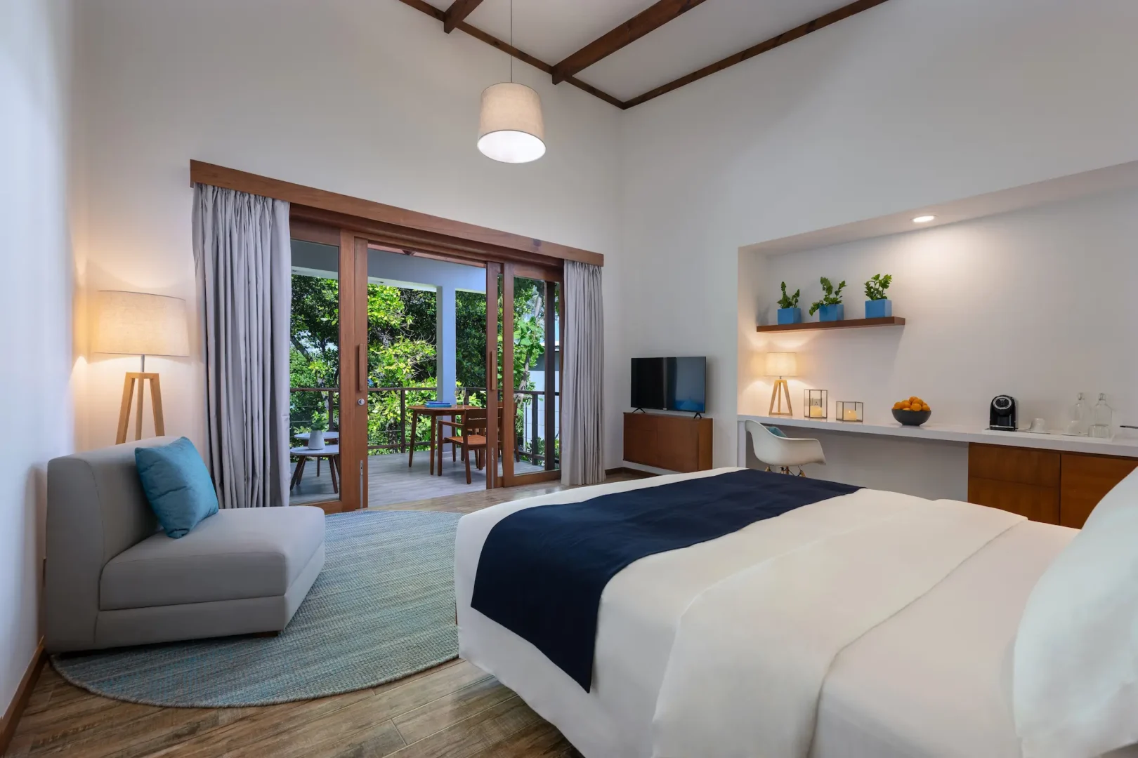 ifuru island maldives sunset sky suite interior with refined contemporary design and serene luxury ambience