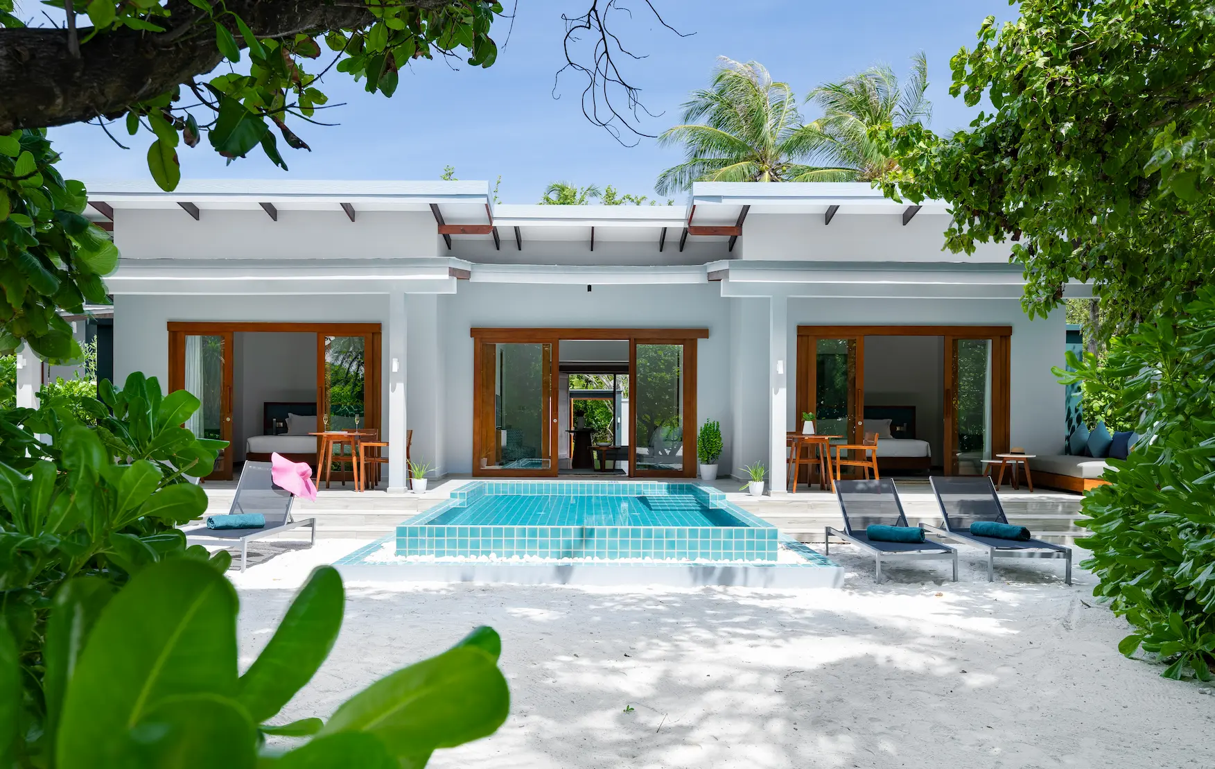 ifuru island maldives sunset two bedroom villa with pool exterior featuring elegant contemporary beachfront design and serene island luxury ambience