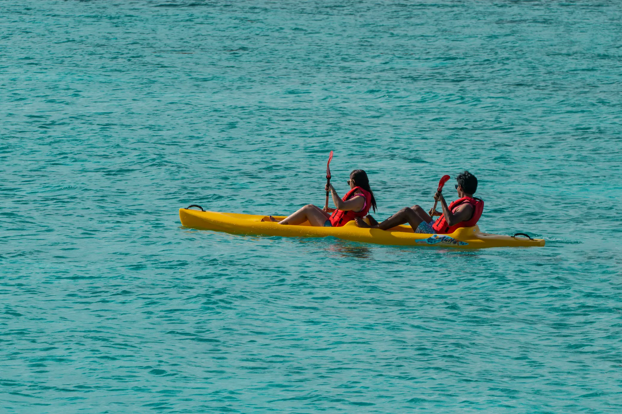ifuru islands maldives watersports kayak lagoon paddling experience in turquoise waters