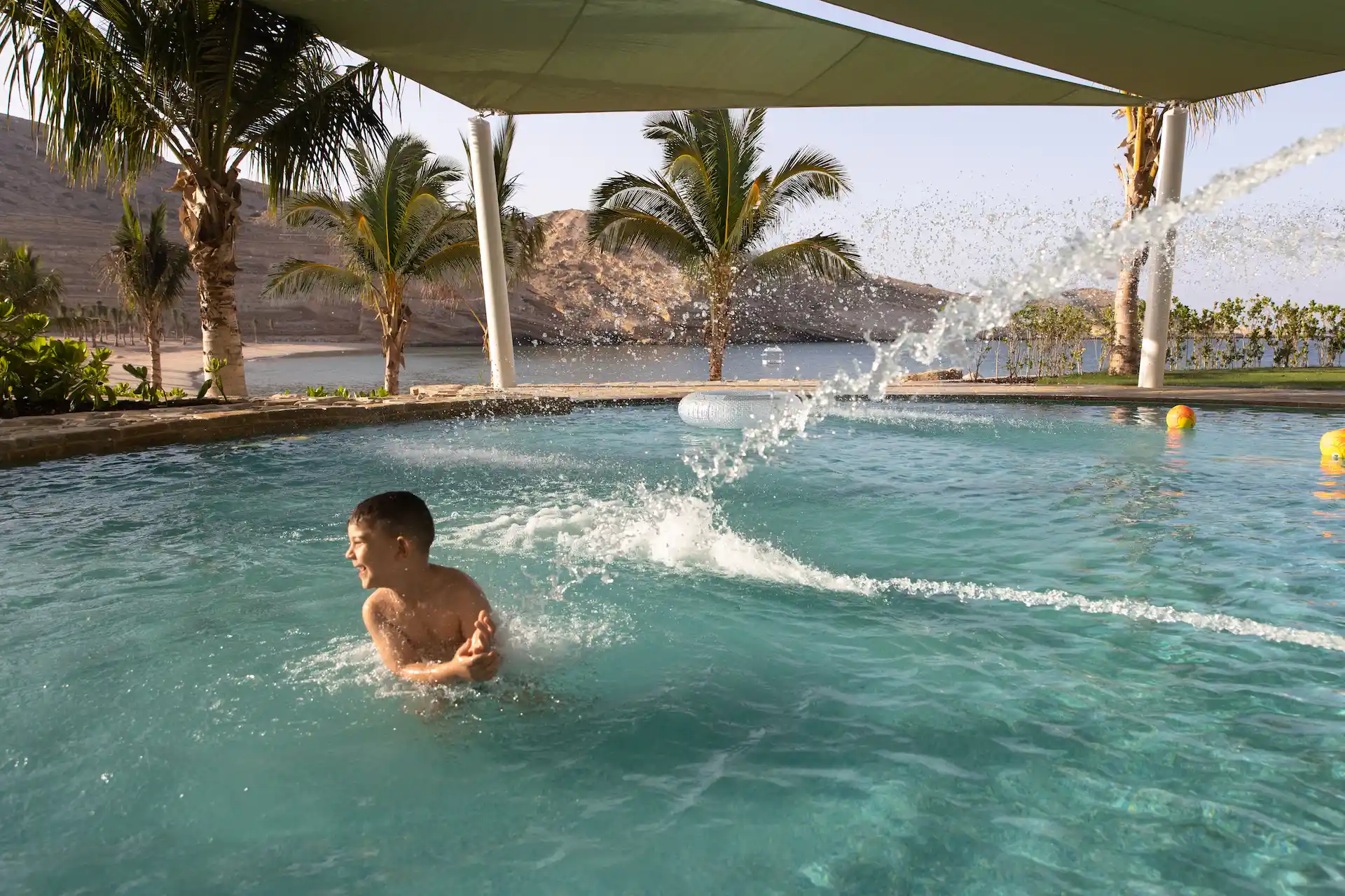 kids pool at jumeirah muscat bay oman featuring shallow water play area and family friendly resort swimming facilities
