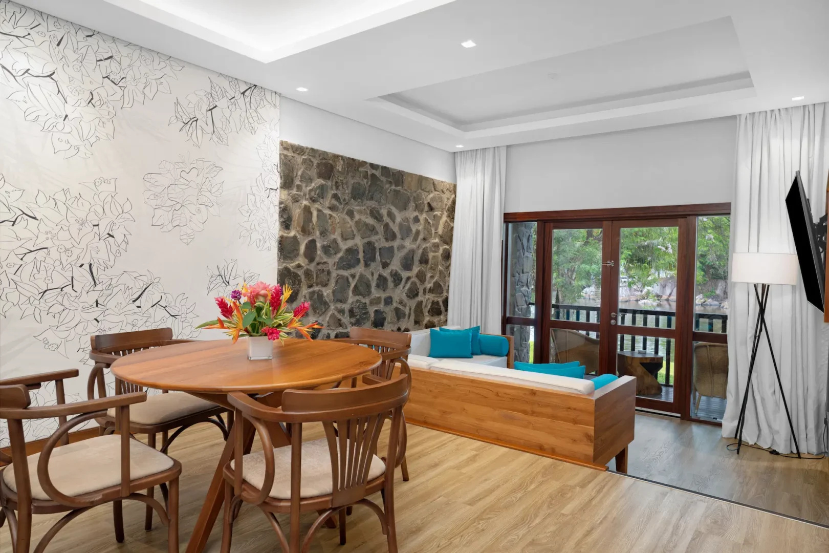 kempinski seychelles resort deluxe lagoon view suite dining room with table and lagoon view