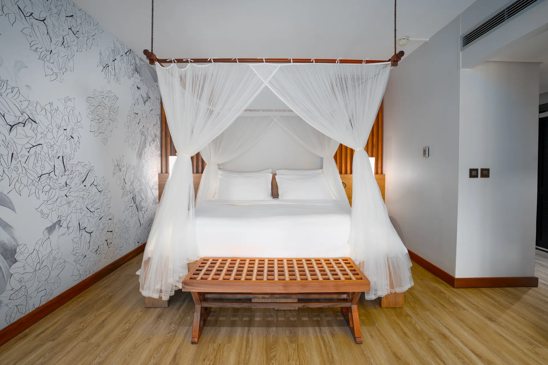 kempinski seychelles resort deluxe lagoon view room with lounge and bedroom area overlooking lagoon