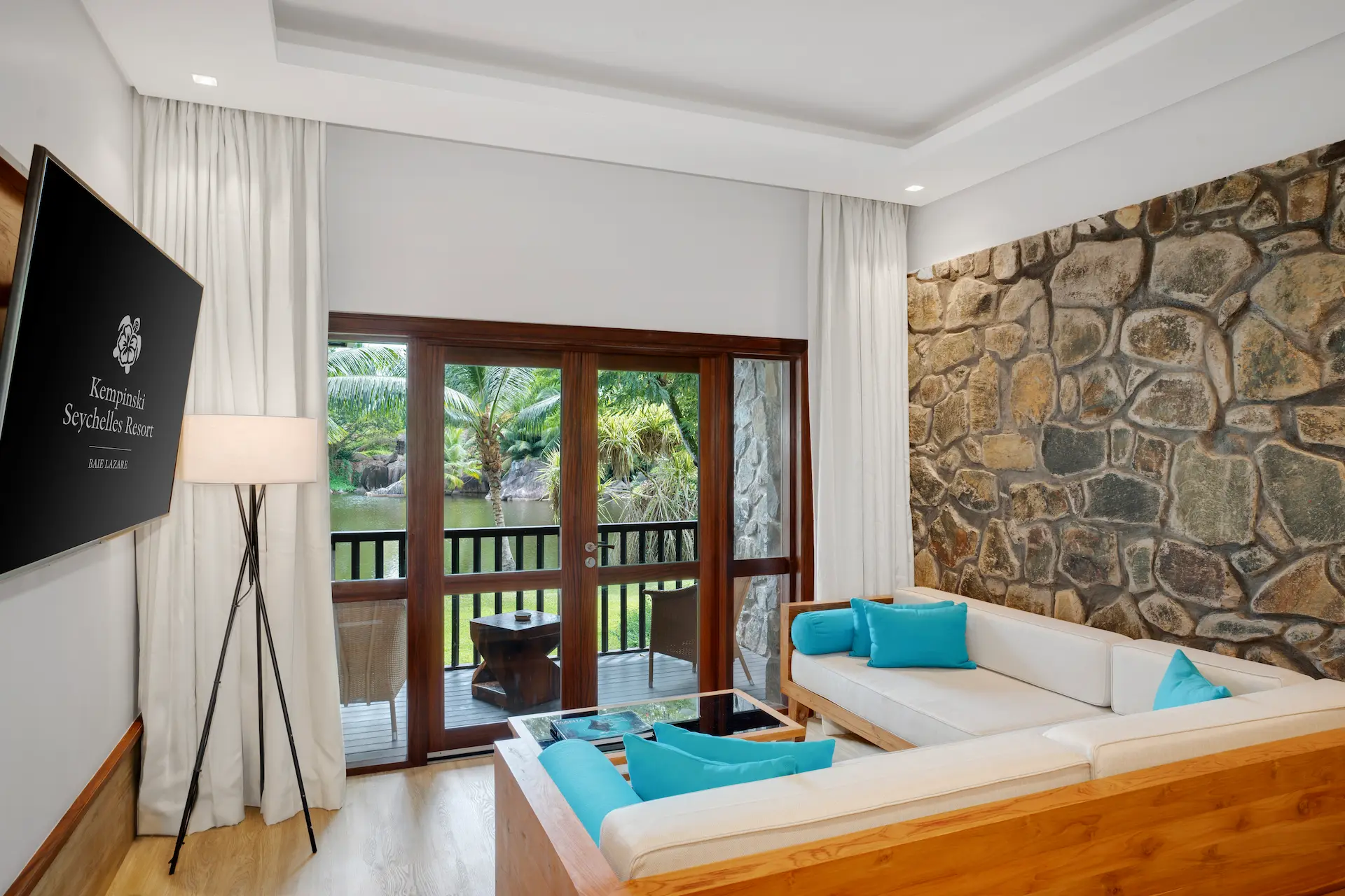 kempinski-seychelles-resort-deluxe-lagoon-view-room-lounge-tv