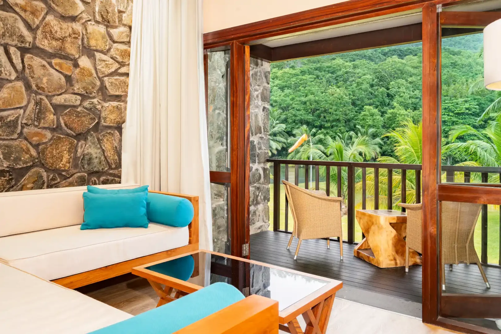 kempinski seychelles resort deluxe lagoon view room lounge area with seating