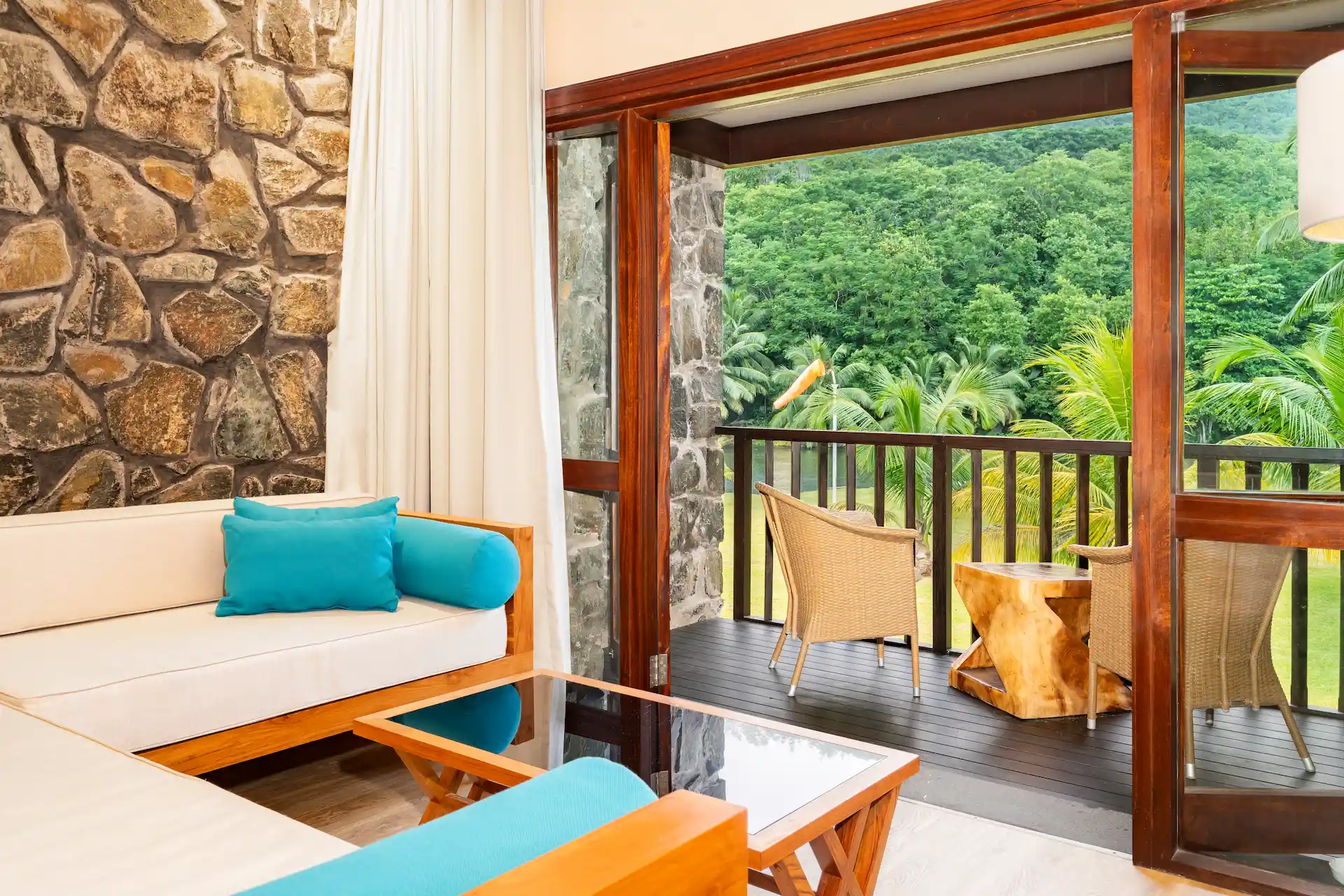 kempinski seychelles resort deluxe lagoon view room lounge area with seating