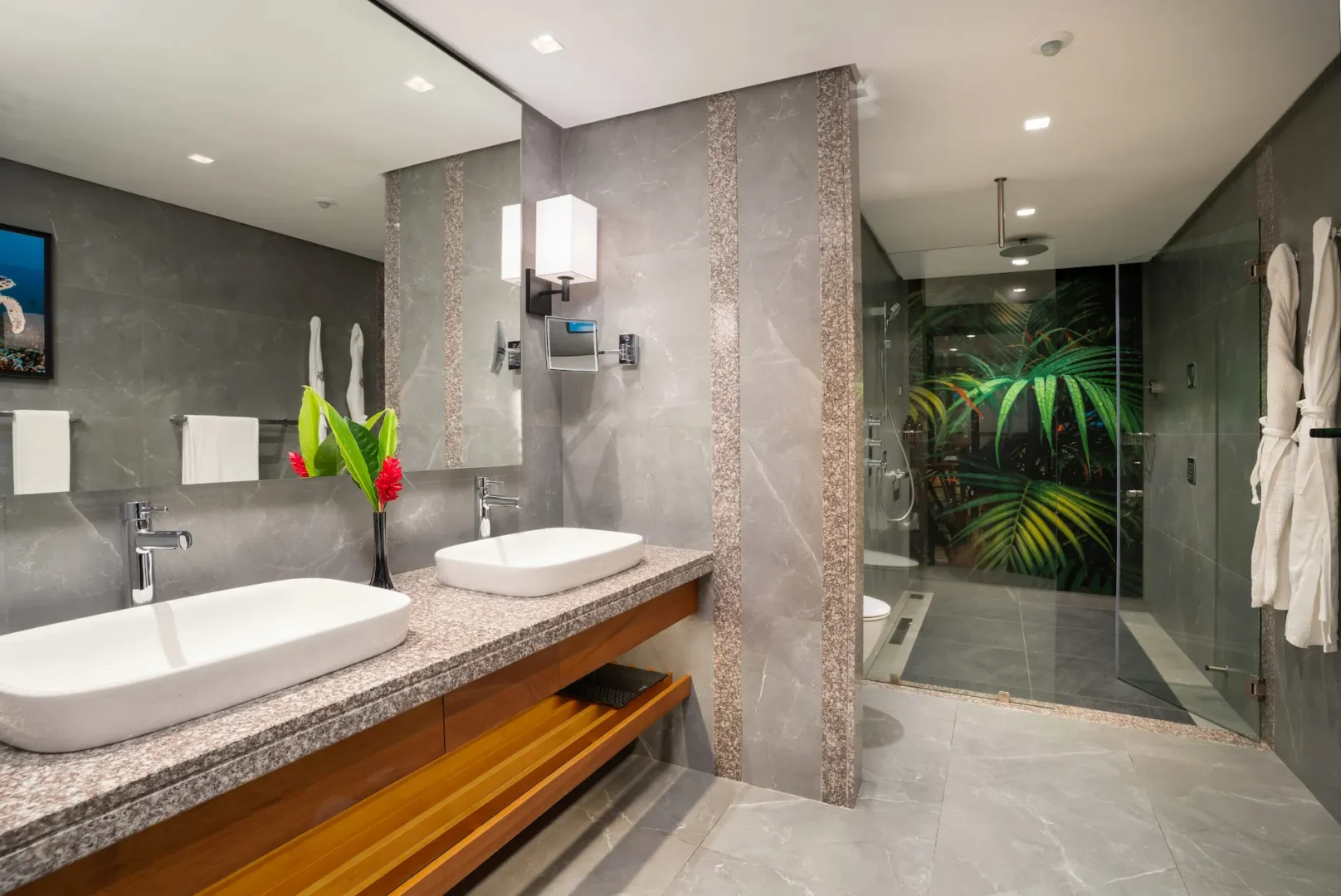 kempinski seychelles resort deluxe lagoon view room bathroom with double sinks and modern design