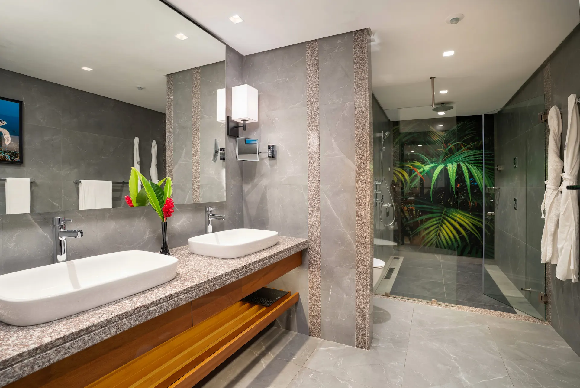 kempinski seychelles resort deluxe lagoon view room bathroom with double sinks and modern design