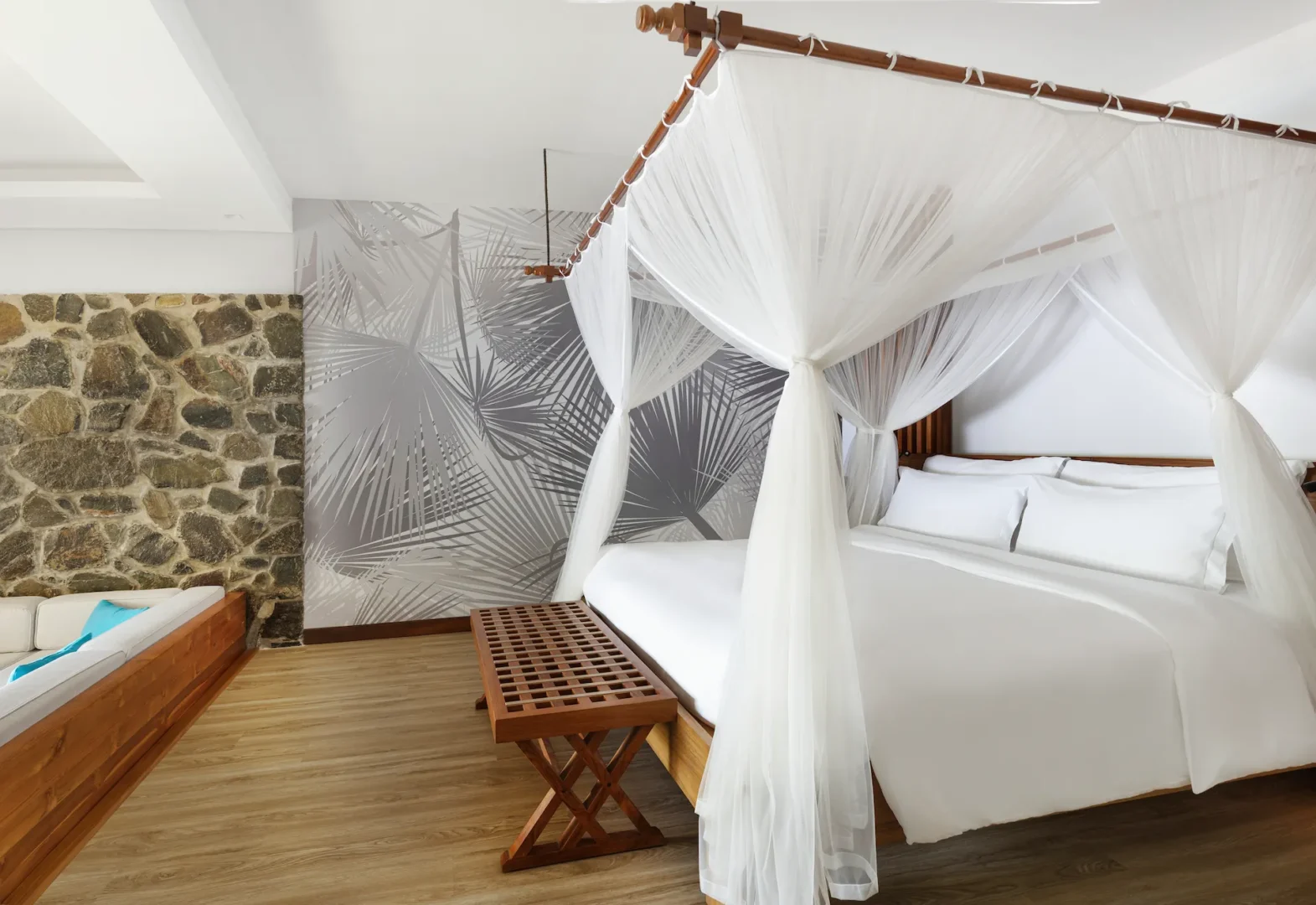 kempinski seychelles resort superior hill view room with bed and ocean view