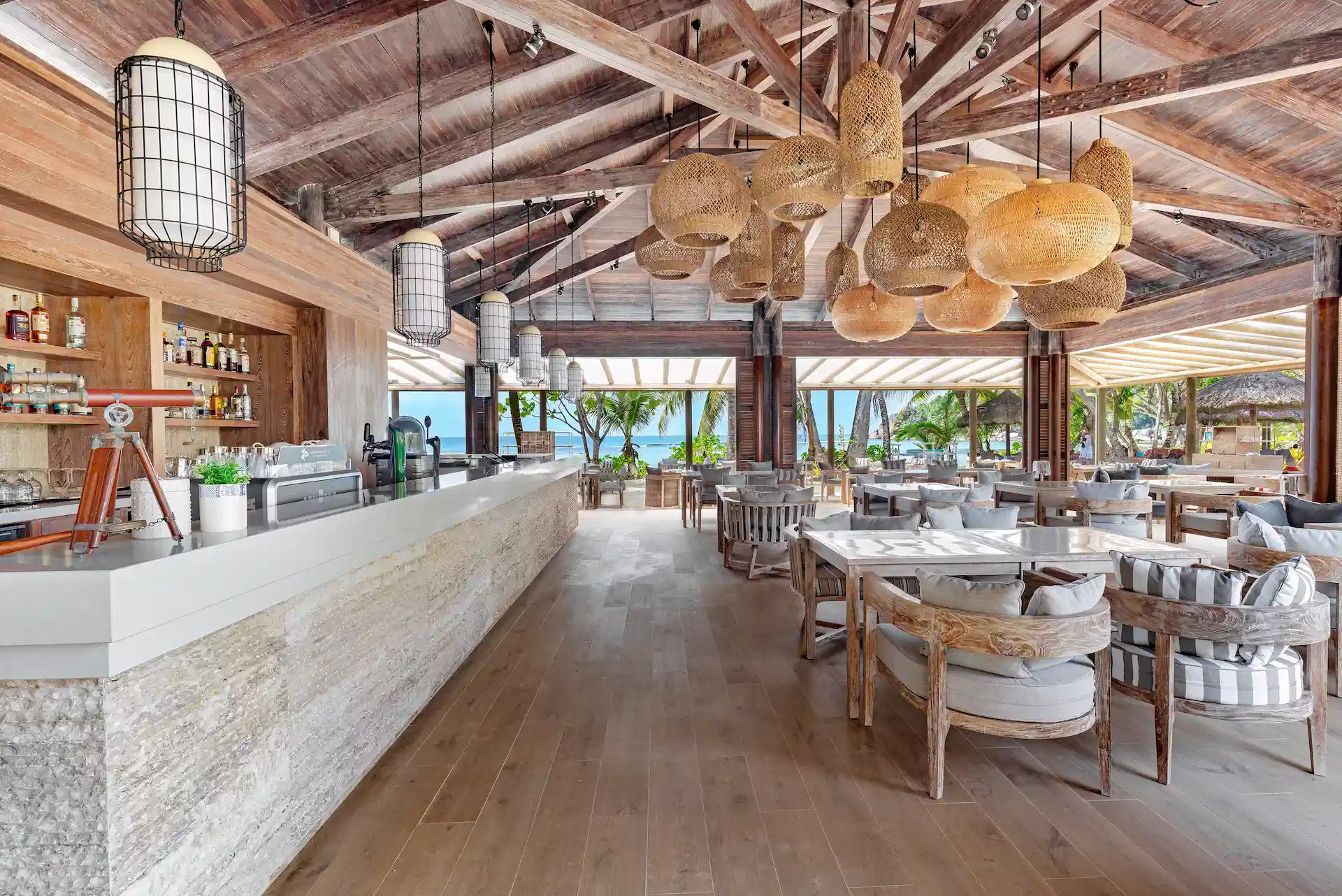 kempinski seychelles resort windsong restaurant with outdoor seating and ocean view