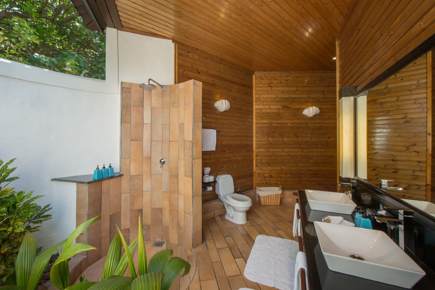 komandoo maldives beach villa bathroom shower offering serene luxury island ambiance