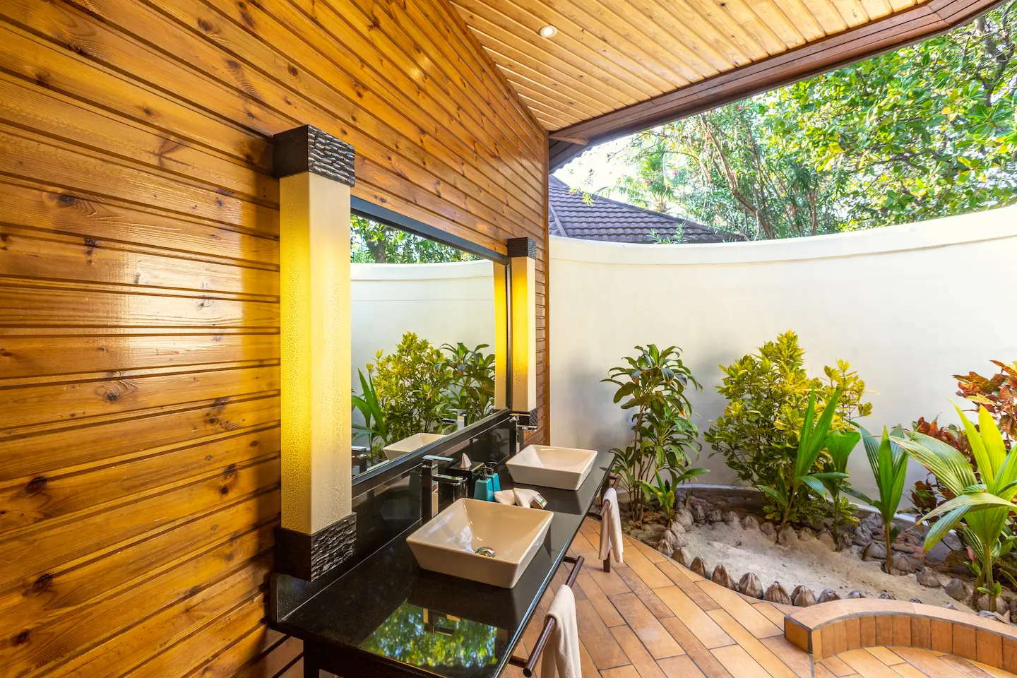 komandoo maldives jacuzzi beach villa bathroom sink featuring elegant island luxury detailing